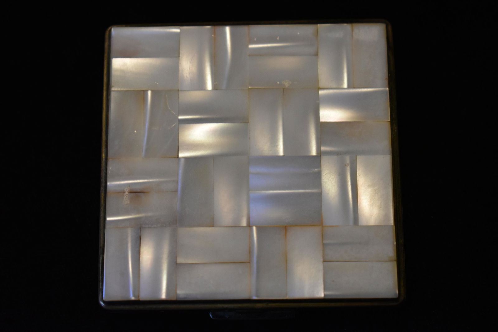 Early 1900's Mother of Pearl Powder Box: Early 1900's Mother of Pearl Powder Box. Has some wear to the metal finish but still in collectible condition. 2 1/2" by 2 1/2"