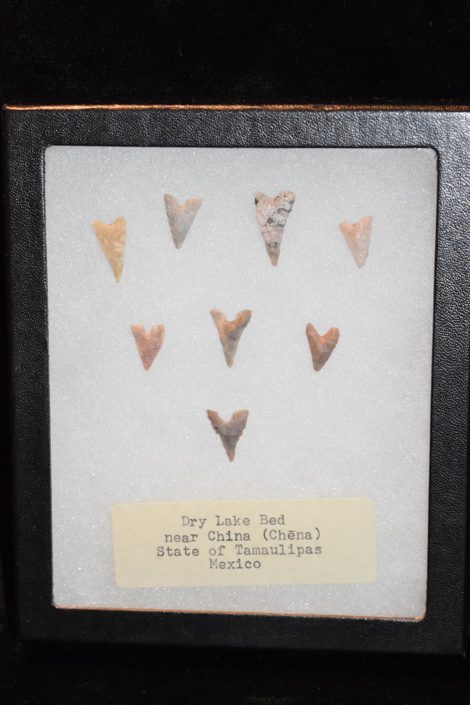 8 Nicely Made Garza Arrowheads from Mexico: 8 Nicely Made Garza Arrowheads found near Dry Red Lake near China, Mexico. Longest arrowhead is almost 7/8" Frame included and measures 6 1/8" by 5 1/4"