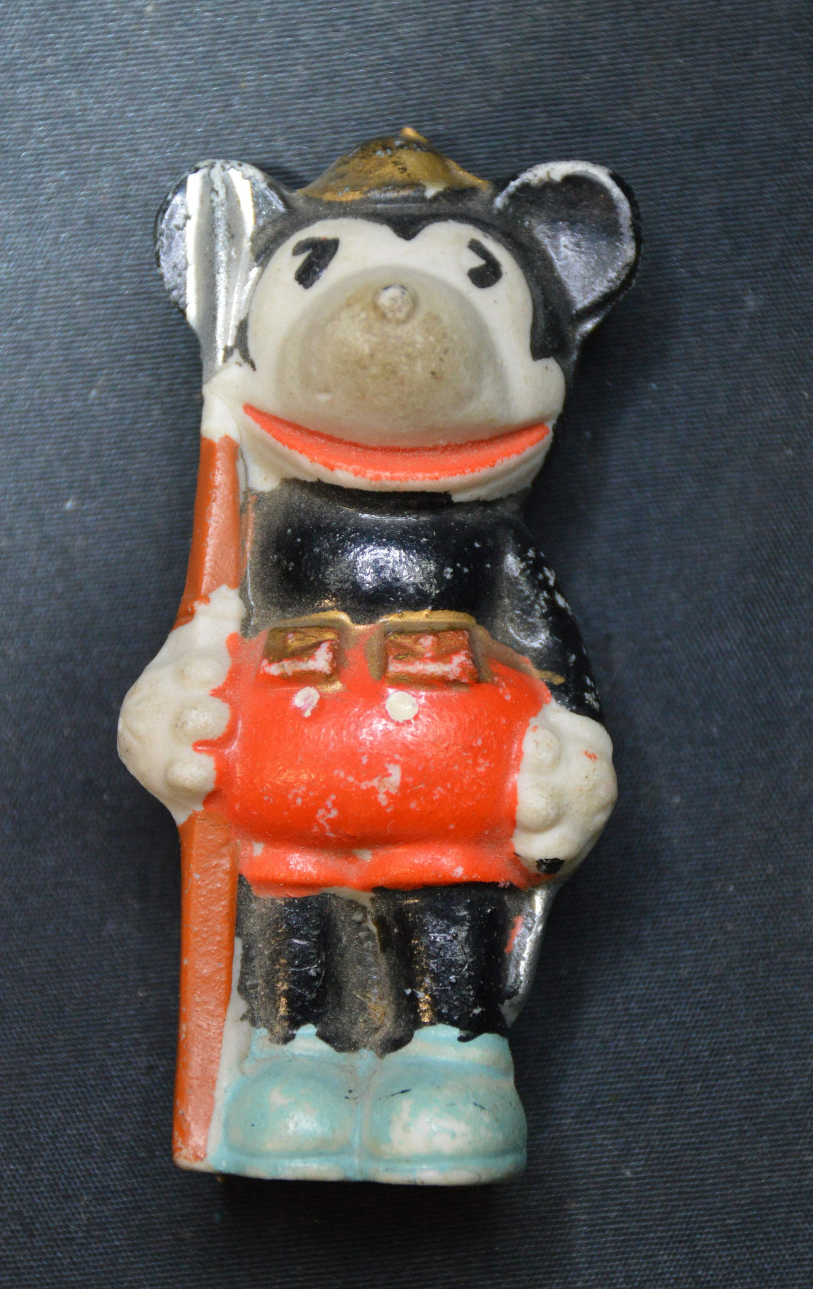 DISNEY 1930's "MICKEY MOUSE SOLDIER HOLDING RIFLE: Has Walt Disney on the back. A little missing paint but in original condition which is good for it being glass. Stands 3 1/4 inches tall.