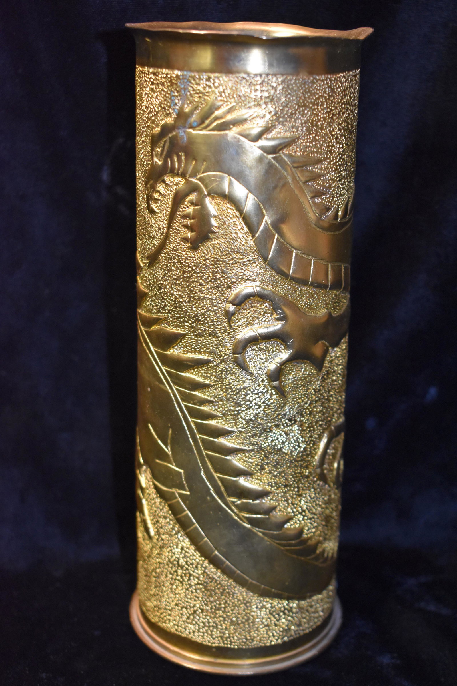 WWI DRAGON Trench Art Naval Landing Gun Casing: WWI DRAGON Trench Art Naval Landing Gun Casing. This is a very rare shell that was used in Trench Art and the artistry is exquisite. It is one dragon going all of the way around the shell with its hea