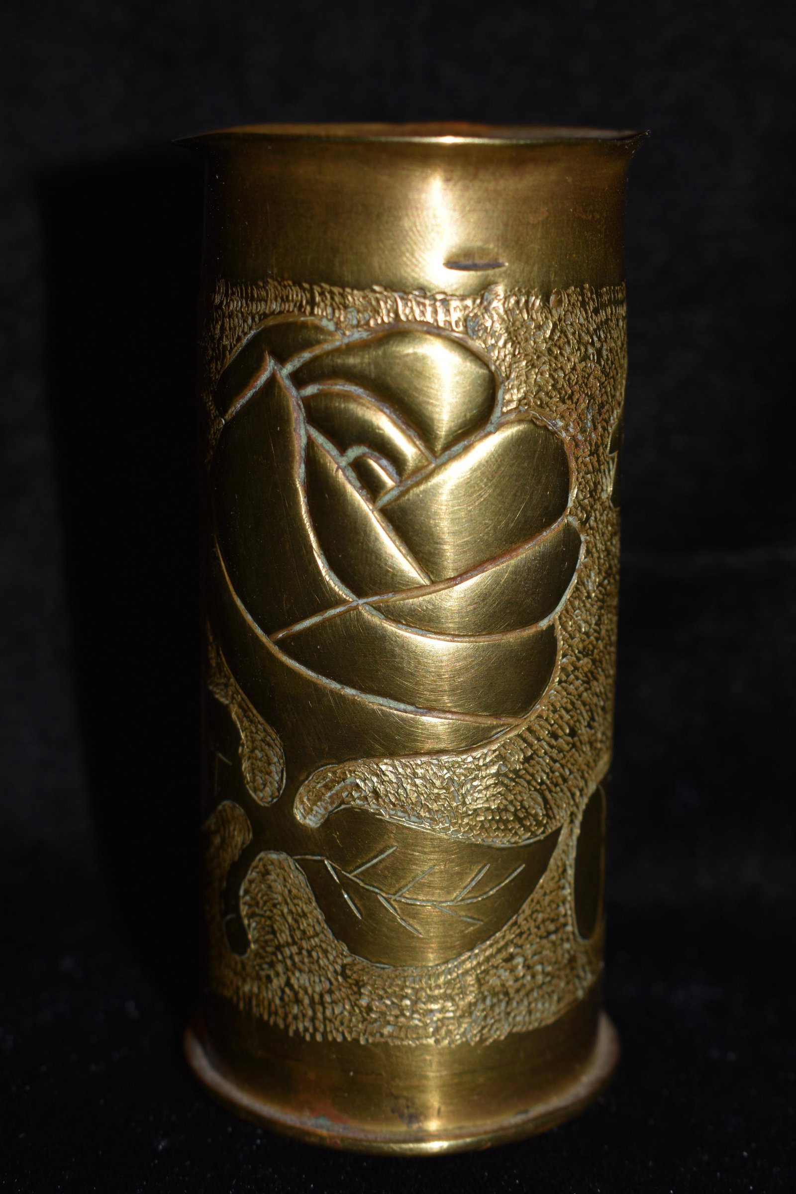 1916 37MM Trench Art Pencil Holder: 1916 37MM Trench Art Pen or Pencil Holder. There is a cut off smaller casing incorporated through the base of this shell which perfectly fits a pencil sitting in it. The Casing has a Rose Motif with l
