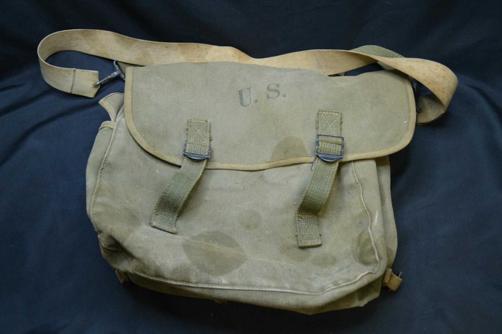 U.S. Military Travel Bag: In good condition because of the couple water spot stains. Latches and straps are present and in good condition.
