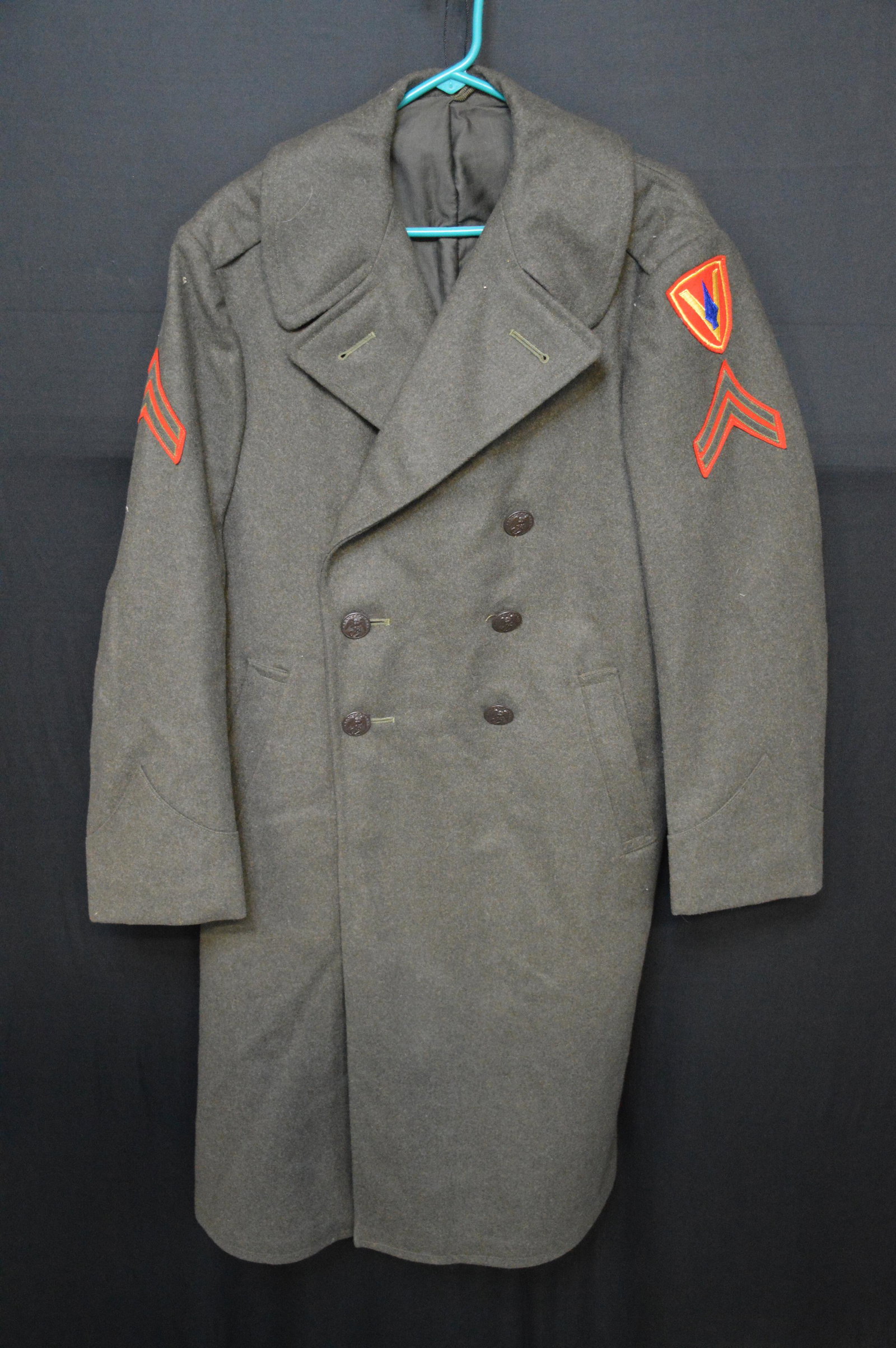 Wool U.S. Marine Military Coat: Probably from during the Korean War. Leslie Eddington was a sniper in the Marines during that time.
