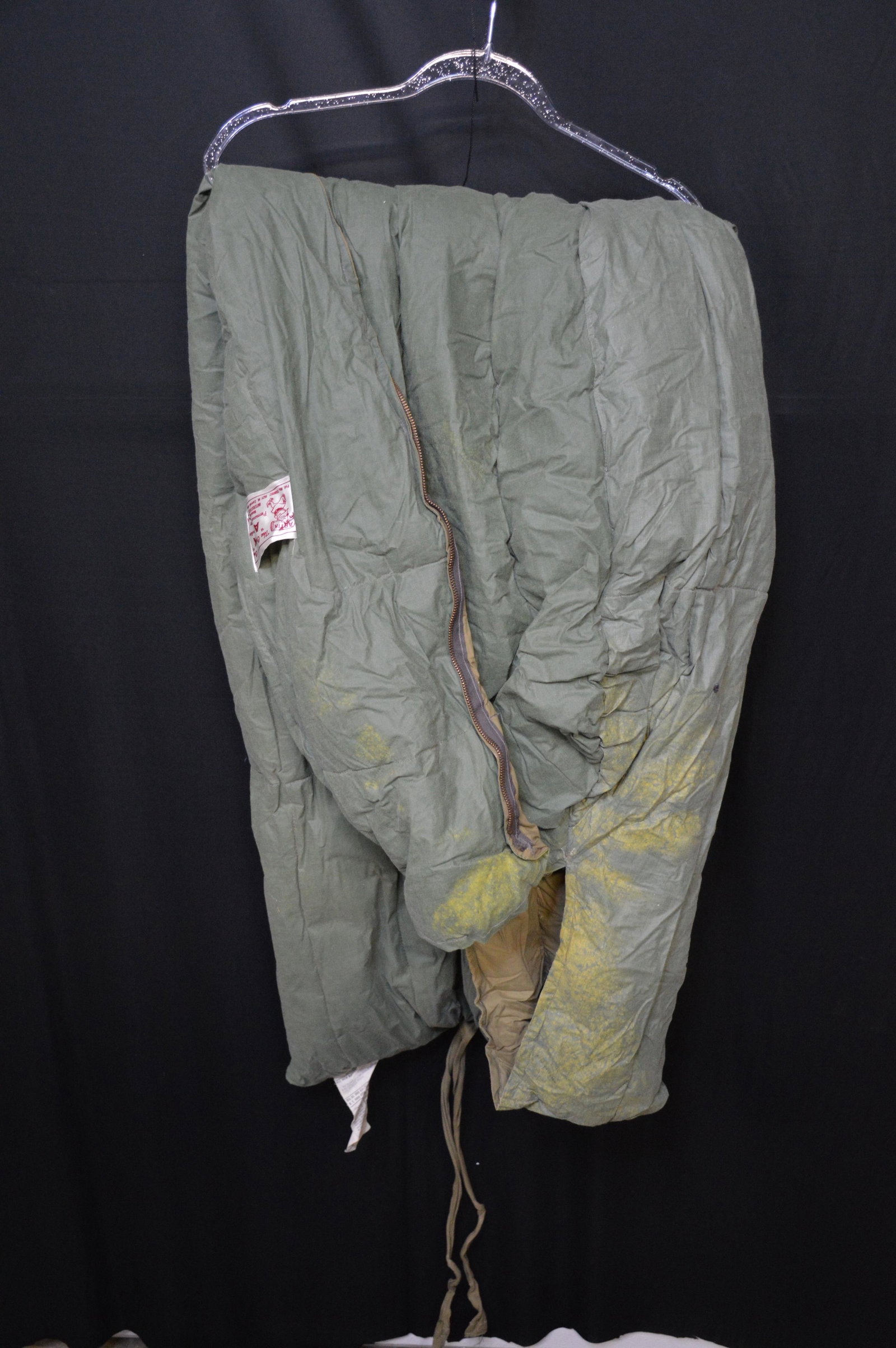 Artik Sleeping Bag: Would have been used by Leslie Eddington while he was in Korea during the war. Has some color fading around the head area probably from moisture.