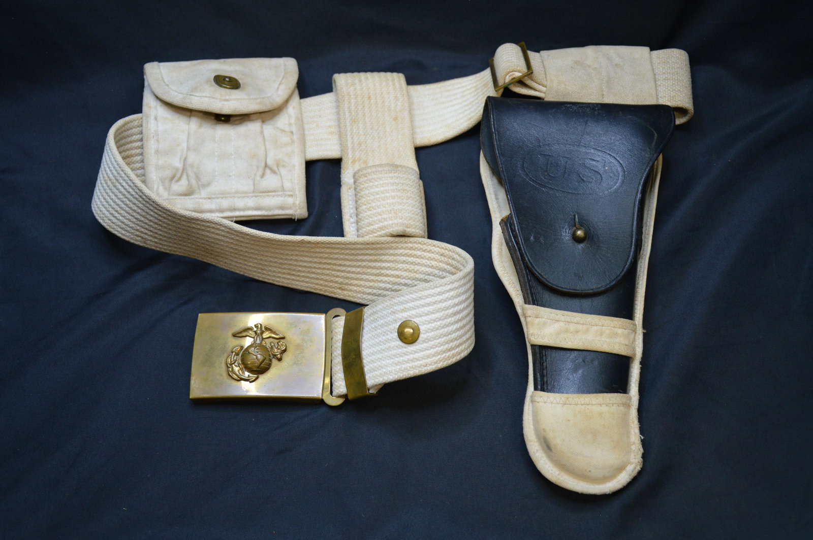 Bolen Lea. Prod. U. S. Pistol Holster: Black leather holster with white canvas belt and clip holder. All are in Great Condition. The belt is Amherst Industries and has a U.S. Marine Corp. Buckle. Serial number on the holster is 7791466