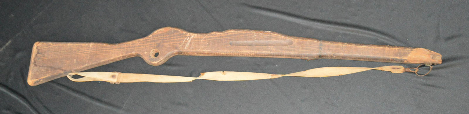 WW1 Bayonet Training Gun: Would have been used by soldiers as a cheaper alternative training device. They must of used it to hard and broke out the spot that would hold the bayonet. 40 inches long.