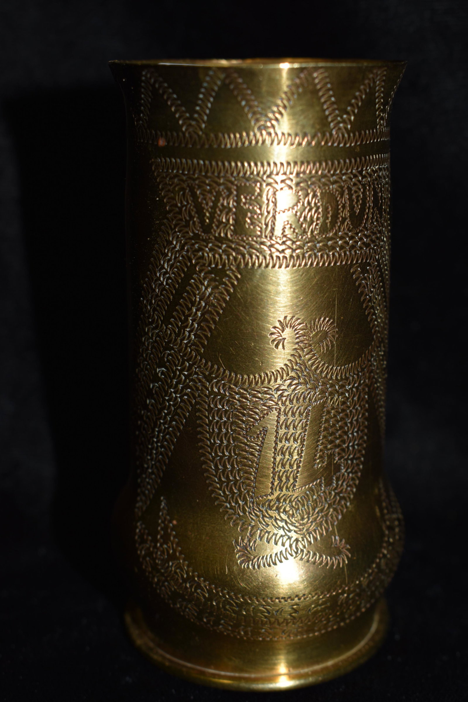 1914 WW1 VERDUN TRENCH ART 37MM CASING: 1914 WW1 VERDUN TRENCH ART 37MM CASING. This casing commemorates the Battle of "VERDUN 1914". It is adorned with leaf and banner patterns. The base of the shell reads 37-85 PDPs 5210 14. It measures 3