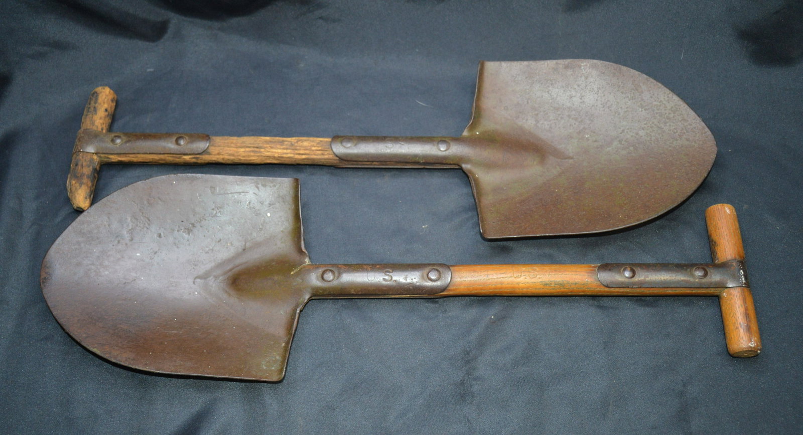 2 WW1 Trench Shovels: One is in great condition the other the wood is weathered. Both have U.S. Stamped in the metal.