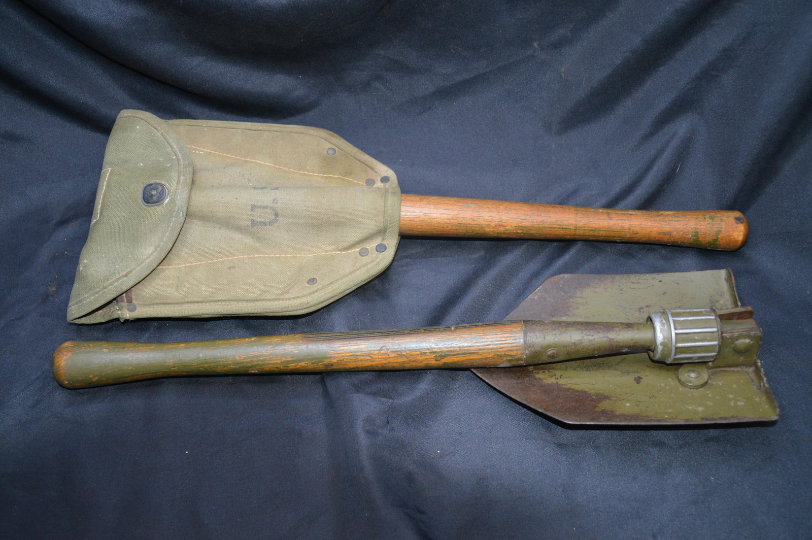 2 WW 2 Trench Shovels: Both are in great condition and have U.S. Stamped in the metal. One has the canvas carrying case.