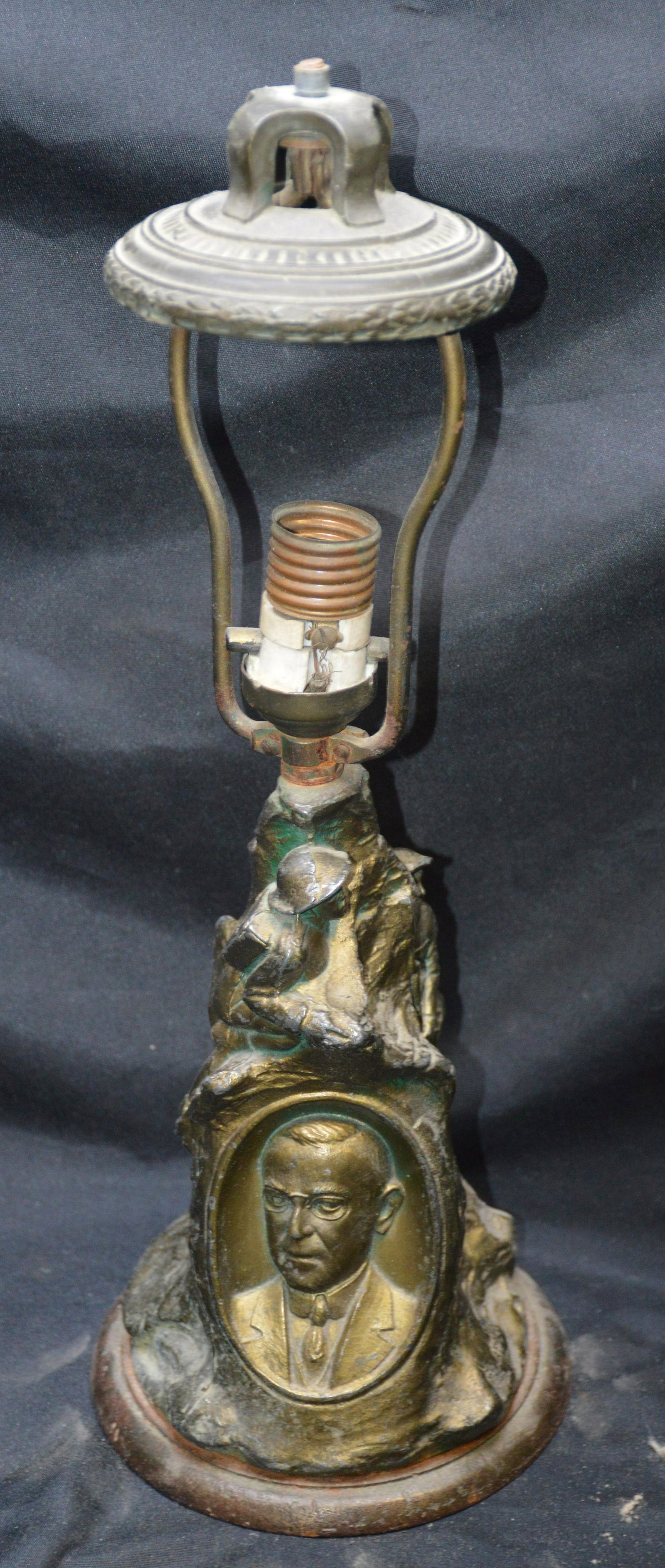President Wilson WW1 Statue Lamp: President Wilson is the rock that the soldiers are counting on depicted in this piece of art. The lamp will need to be rewired. Has Phoenix = Milwaukee. Steel and Brass construction. Stands 15 inches 