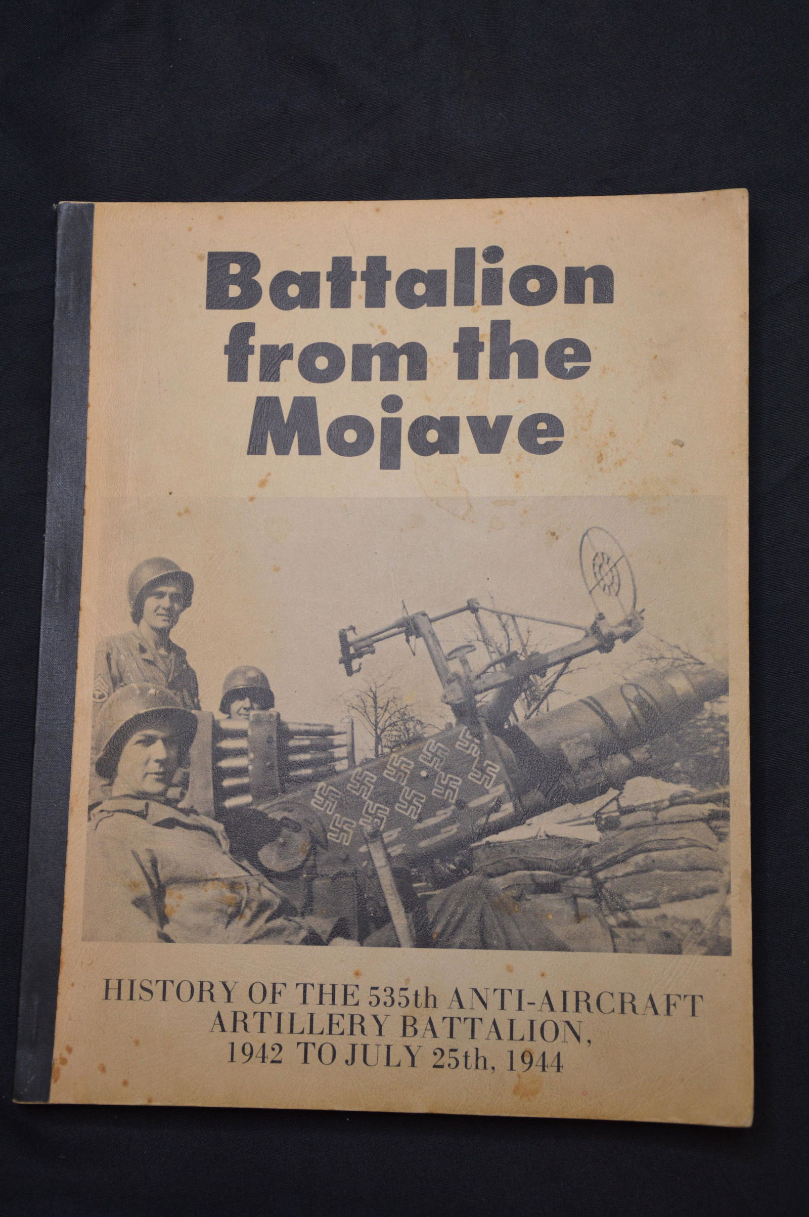 Battalion from the Mojave signed by the Author: History of the 535th Anti - Aircraft Artillery Battalion 1942 to July 25th 1944. Copyright 1971 by Ted Van Arsdol. A note and signature by the author on the first page. Rare book in great condition. S