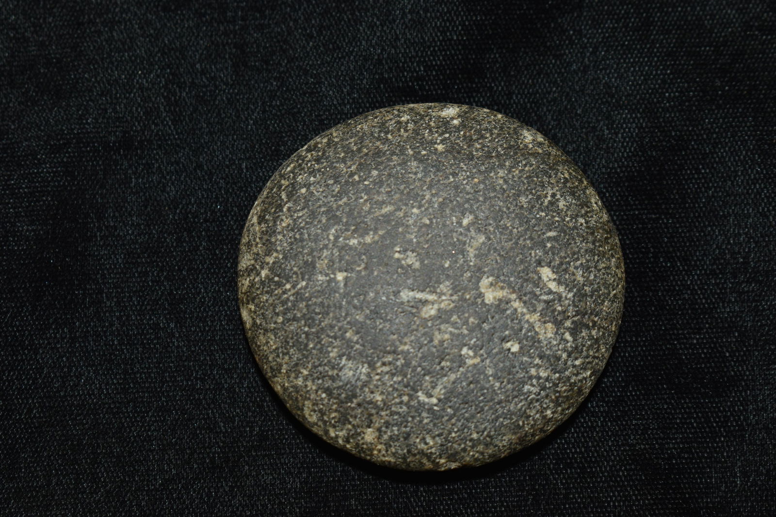 2 1/8" Finely Formed Granite Disc: 2 1/8" Finely Formed Granite Disc found by Don Dye in Tazwell County, Illinois.