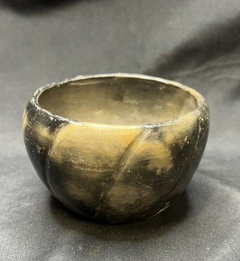 Indian Pot Signed on the bottom.: It's signed on the bottom but I can't make it out for sure. It stands 2 5/8 inches tall and 4 inches wide.
