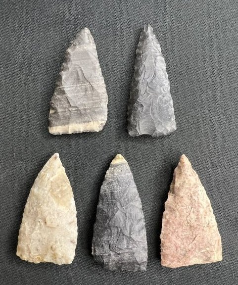 5 Triangle Arrowheads: The longest is 1 7/8 inches. Several have basal thinning. Well made group. Ex: Ben Winchester Collection. Ben owned The South River Fort Museum in Hannibal. Pictured in Artifacts in The News June 1990