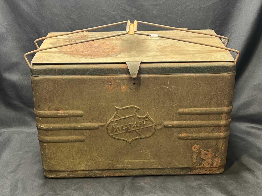 Vintage Falstaff Metal Cooler: Probably 1950's. A little rust and the hinges are broke. The latch is also missing. The size is 9 1/2 x 17 1/2 and 11 1/2 inches tall.