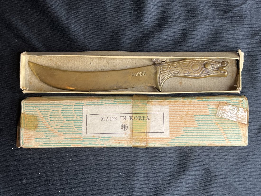 Antique Brass Dragon Letter Opener Made in Korea: Made before 1945 and it great condition. Comes with the original box which is very rare. The design is a dragon with a 4 legged animal on top.
