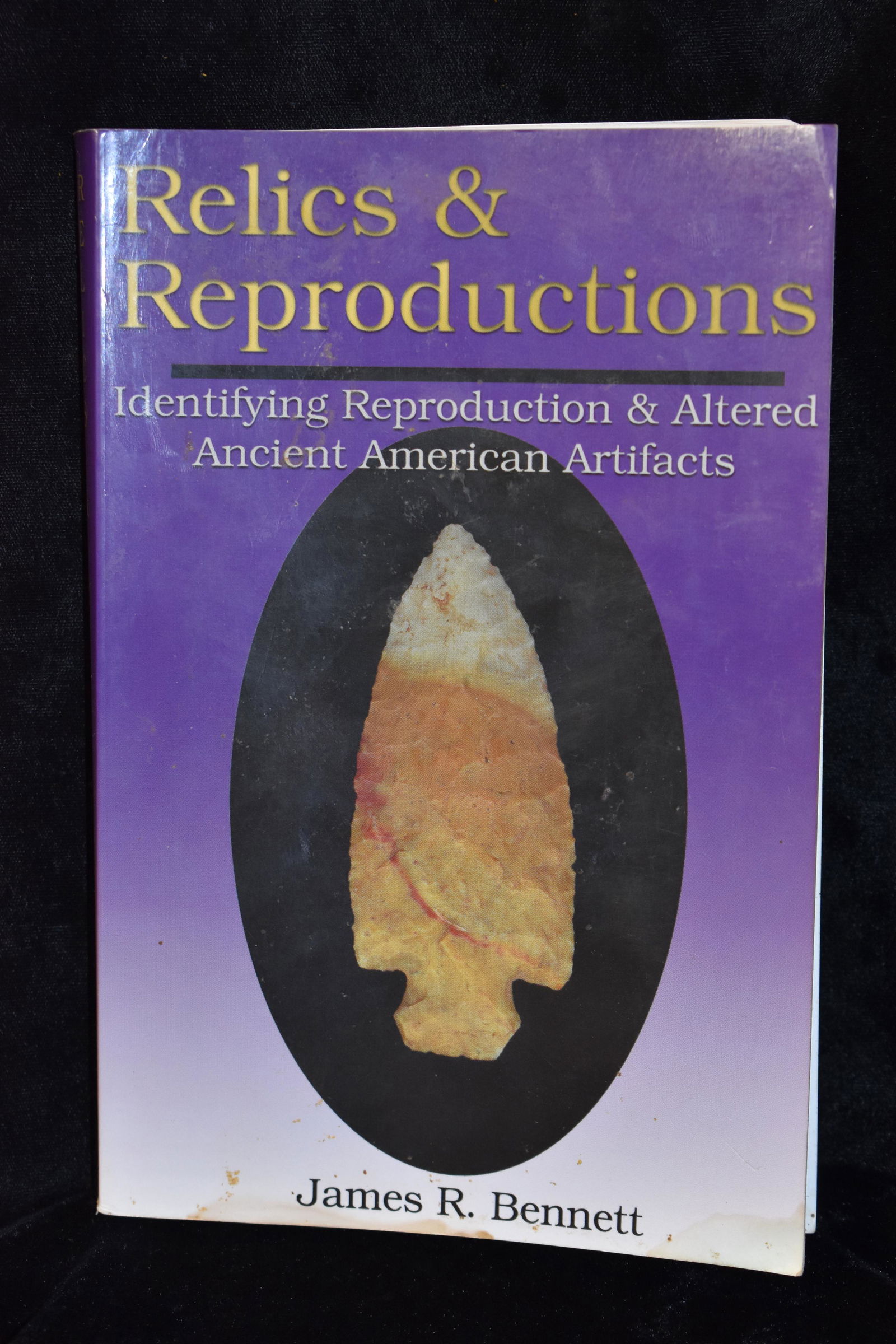 Relics & Reproductions by James Bennett Signed: Relics & Reproductions by James Bennett. Identifying Reproductions & Altered Ancient American Artifacts. Signed by the author. Good book for the starting collector. Softback in good condition. Has a l