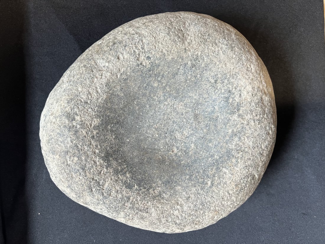 Mortar for grinding corn found Indiana. Ex: Loyd Gladstone Collection. 9 1/4" Diameter, 3 1/4": Mortar for grinding corn found Indiana. Ex: Loyd Gladstone Collection. 9 1/4" Diameter, 3 1/4" Thick.