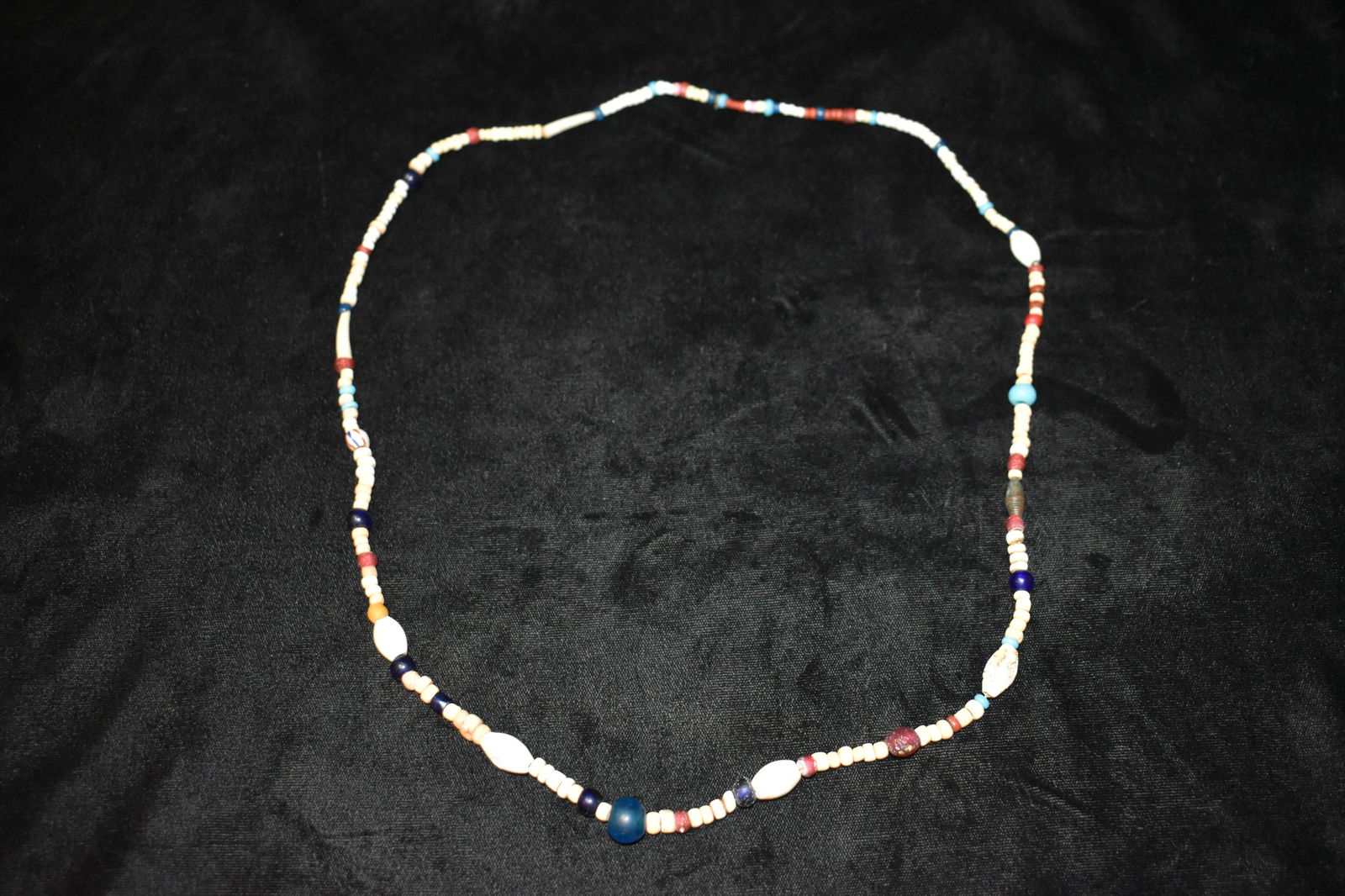 Vintage Native American Trade Bead and Bone Necklace: Vintage Native American Trade Bead and Bone Necklace. There is a wide range of beads used in this necklace. Bone, glass and a few that look like coral. A very old Indian necklace. Excellent condition