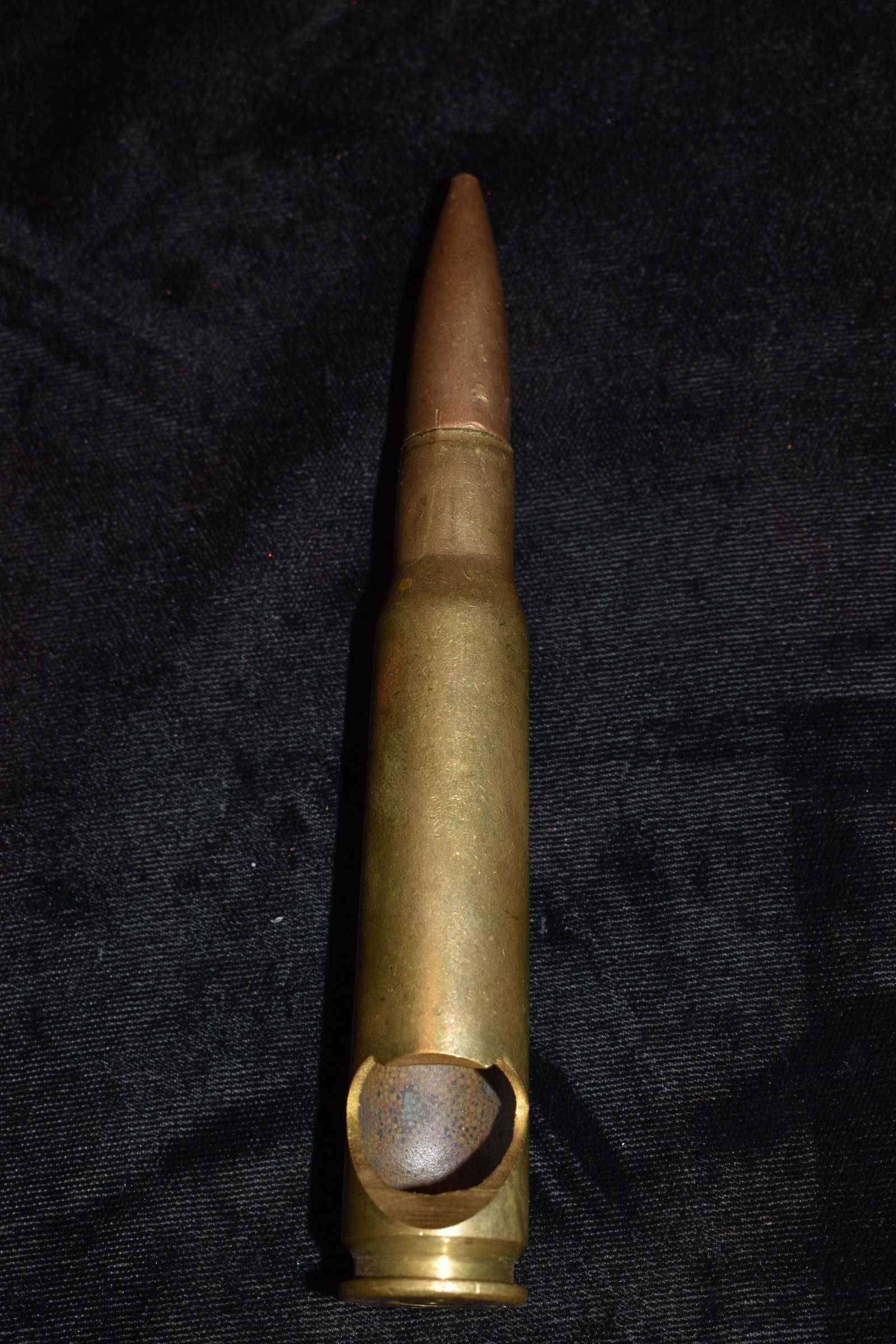 50 Caliber Bottle Opener Trench Art: This is a fifty caliber round that has been repurposed in to a bottle opener. The base of the shell reads CL60. It measures 5 1/2" Long. This is not a live round.