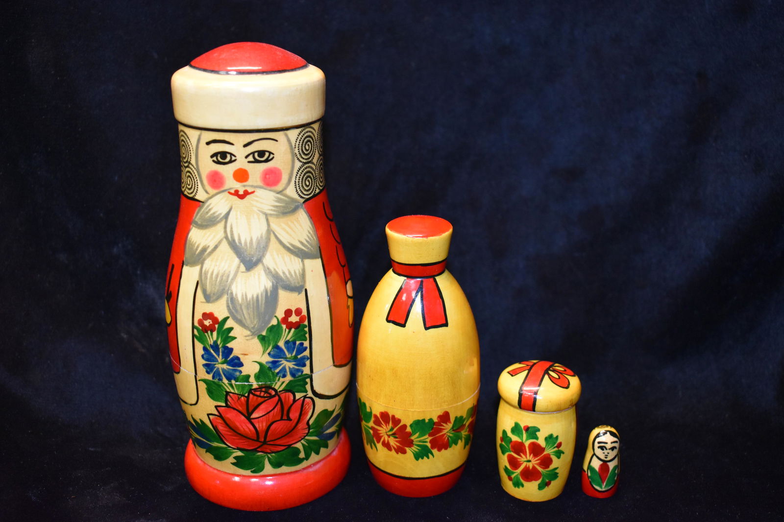 4 Vintage Matryoshka Wooden Nesting Dolls: Set of 4 Vintage Hand Crafted and Painted Matryoshka Wooden Nesting Dolls. All 4 pieces are in excellent condition. Largest piece has its made in Russia Sticker still in place with original purchase p