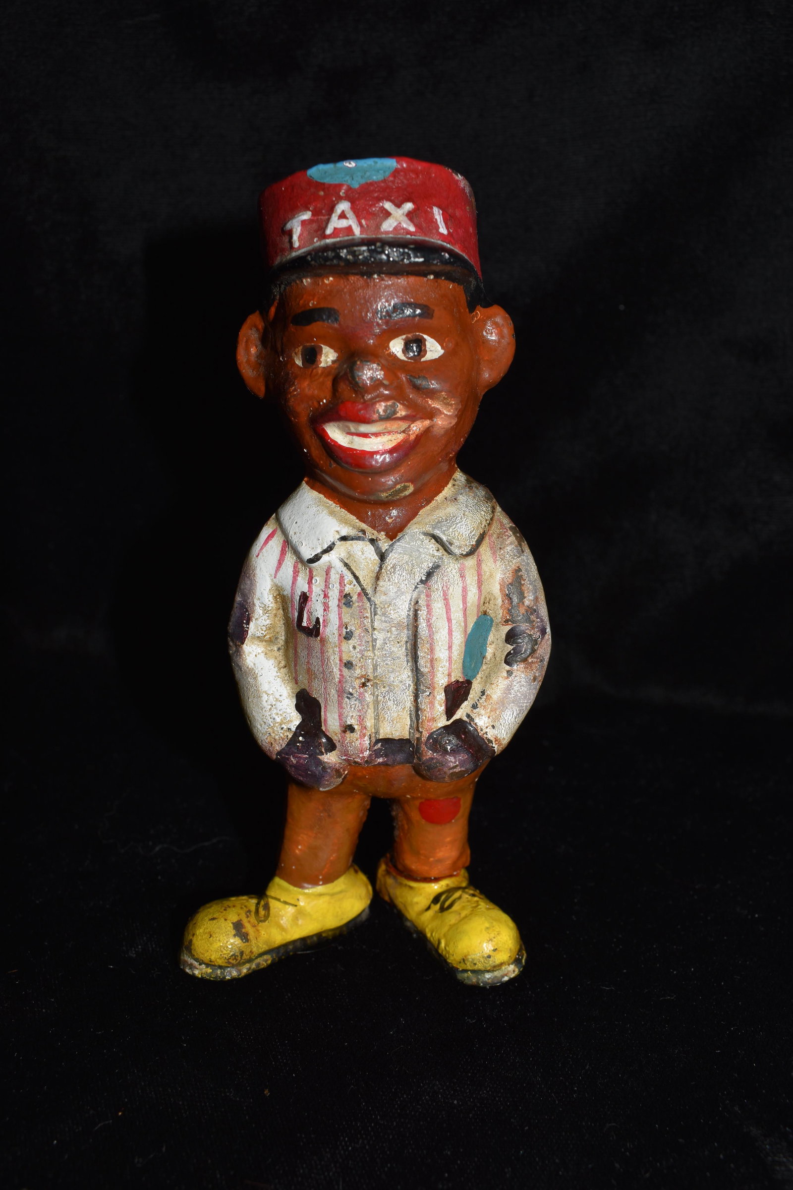 Black Americana Cast Iron TAXI DRIVER Coin Bank: Vintage Black Americana Cast Iron TAXI DRIVER Coin Bank. Excellent condition for its age. He has a little wear to paint here and there and some patina from age. 5 1/4" Tall