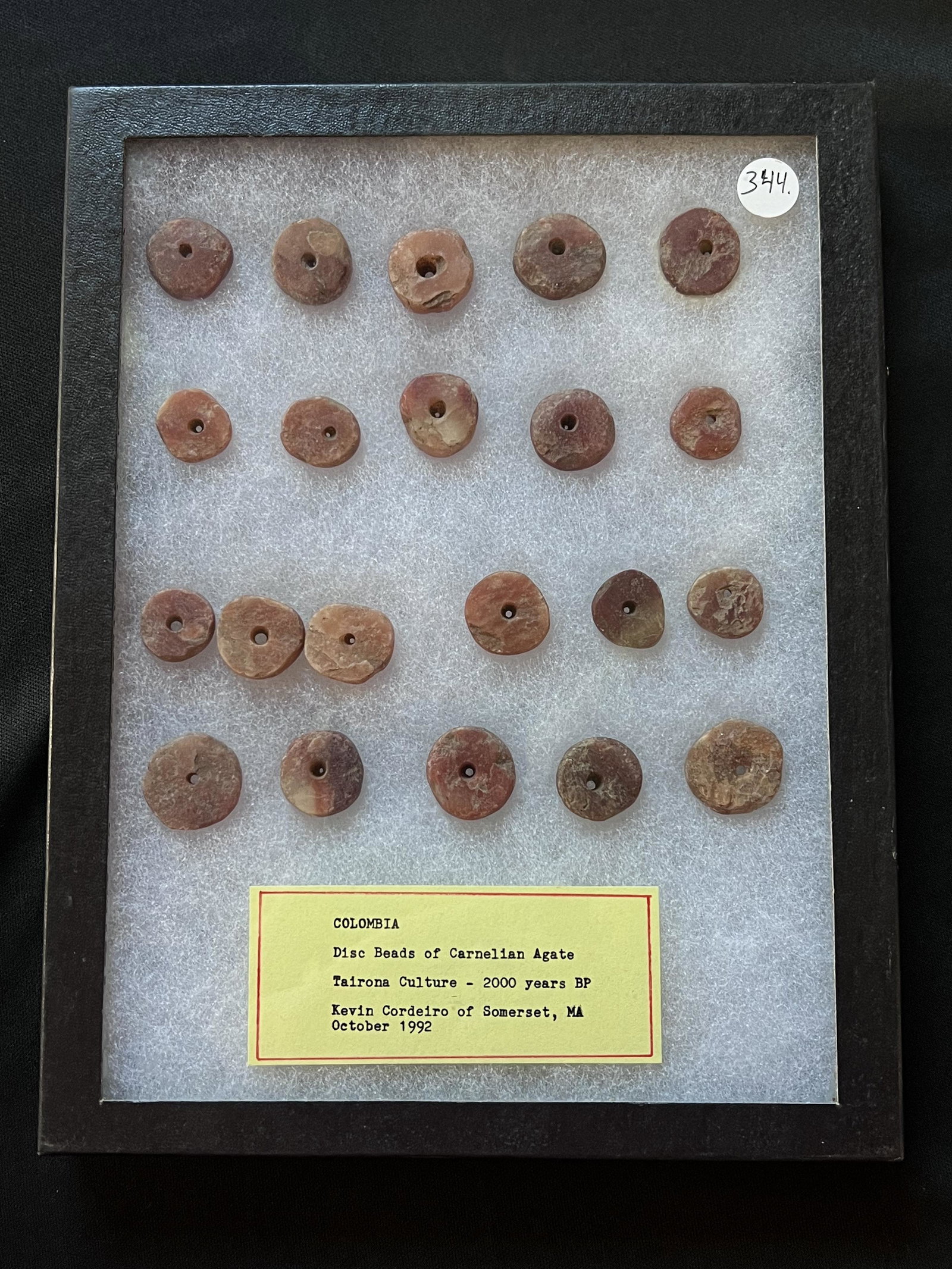 Case of 21 Colombia Disc Beads of Carnelian Agate. Tairona Culture - 2000 years BP. Ex: John: Case of 21 Colombia Disc Beads of Carnelian Agate. Tairona Culture - 2000 years BP. Ex: John Grenawalt Collection. The case is included. Ancient prehistoric authentic native american artifacts.