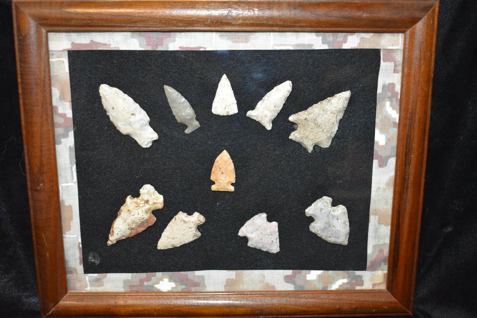 Frame of 10 Arrowheads from the Karollynn Sizemore Collection: Robinson, gibsons and other woodland Arrowheads found in Randolph County, Missouri. They measure 1 1/8" to 2 1/8". Frame is 11 3/8" by 9 3/8" Ancient prehistoric authentic native american artifacts.