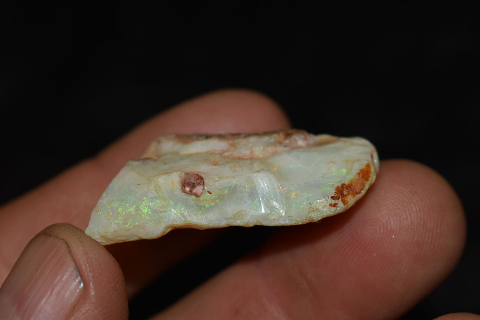 8 Gram White Opal with Green Fire from Australia (Jewelry grade): 8 Gram White Opal with Green Fire from Australia (Jewelry grade). Measures 1 1/2" by 3/4" by 1/2" From the T. V. Elder Collection