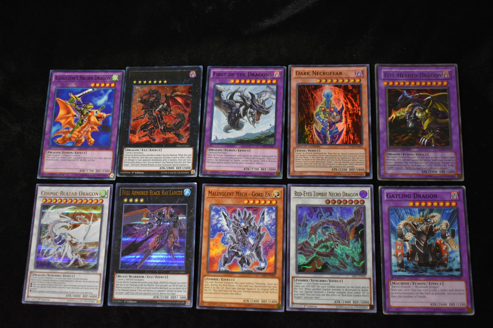 10 1st Edition 1996 Konomi Yu Gi Oh! Trading Cards Dark Necrofear, First of the Dragons: Five Headed Dragon, Red Eyes Flare Metal Dragon , Gatling Dragon, Dark Necrofear, First of the Dragons etc. These cards are quite rare and collected. All 10 cards have minor bumping to at least one co