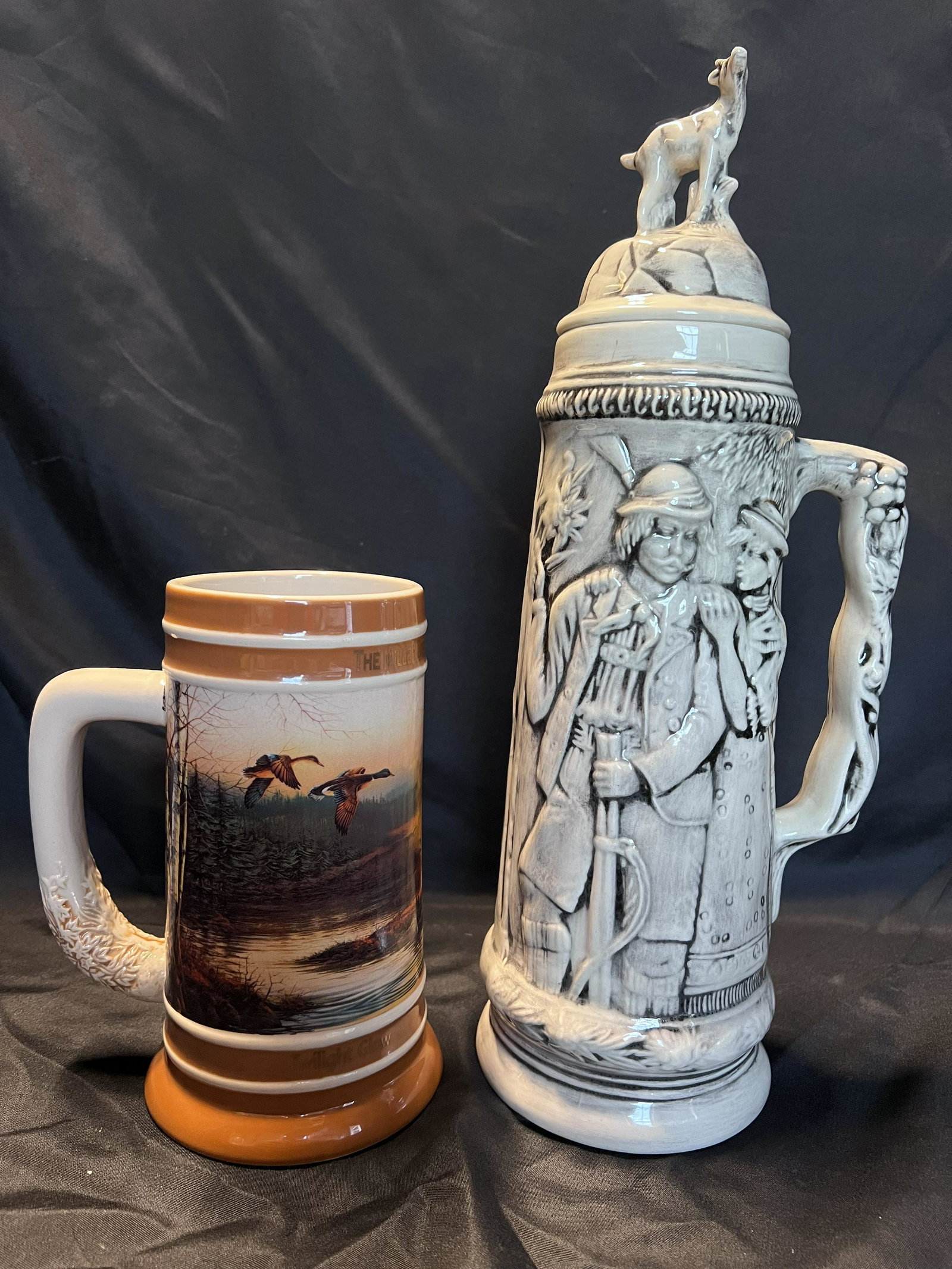 2 Beer Steins. Miller Twilight Glow Terry Collector Series #10469 stands 7 1/4 inches tall. The: 2 Beer Steins. Miller Twilight Glow Terry Collector Series #10469 stands 7 1/4 inches tall. The other is an older probably German Stein with a glass lid that stands 14 1/4 inches tall.