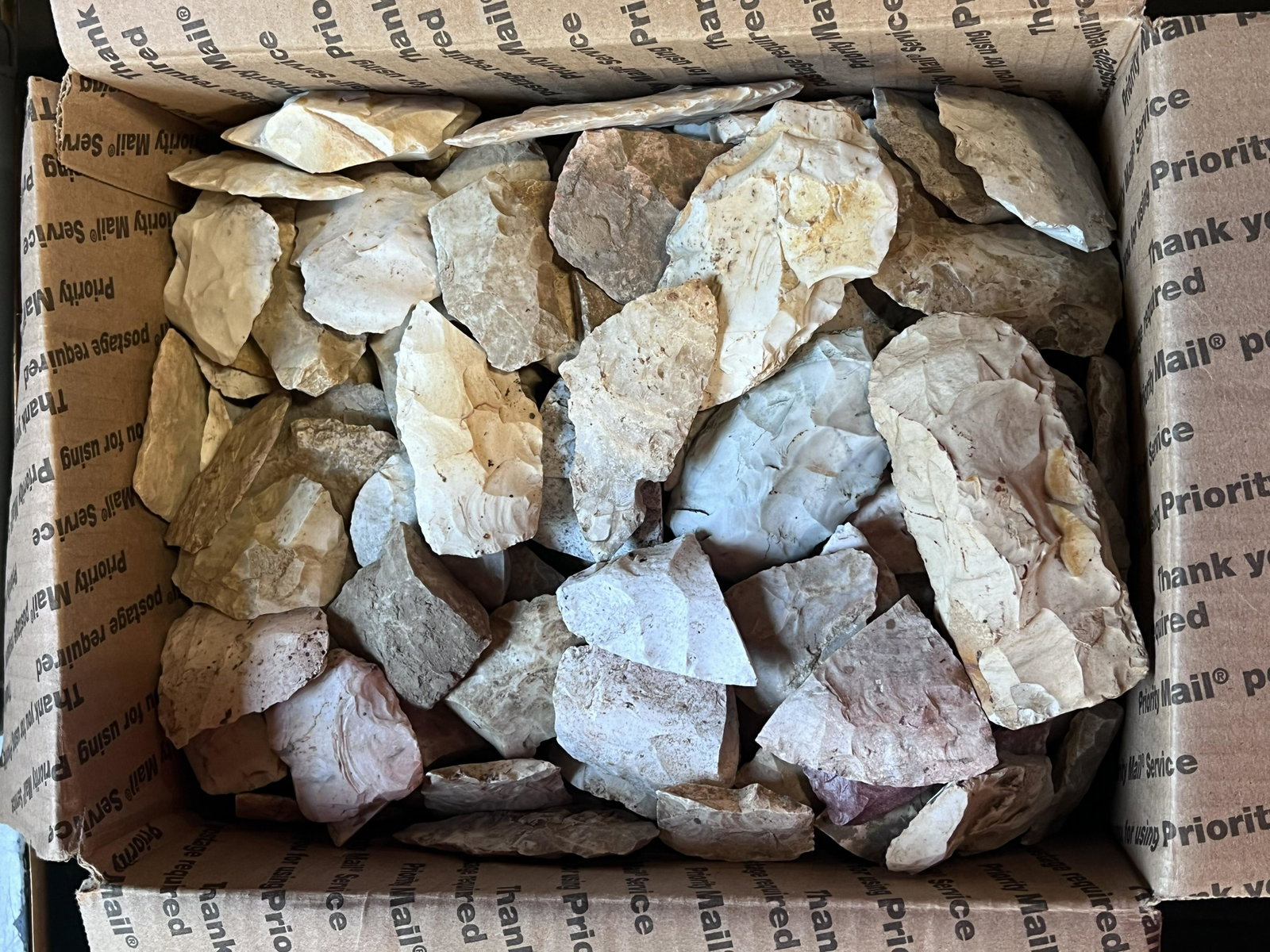 Large Group of Flint Tools in a Medium Flat Rate Box. Most are damaged but still a large pile.: Large Group of Flint Tools in a Medium Flat Rate Box. Most are damaged but still a large pile.