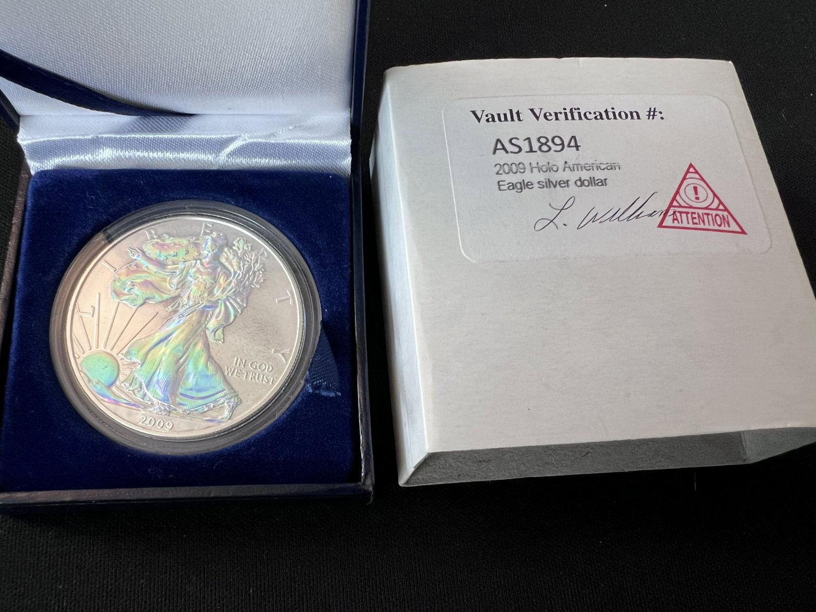2009 Holographic American Eagle Silver Dollar Uncirculated Mint Condition. Vault Verification: 2009 Holographic American Eagle Silver Dollar Uncirculated Mint Condition. Vault Verification #AS1894. In the original box and case. 1 ounce of pure silver.