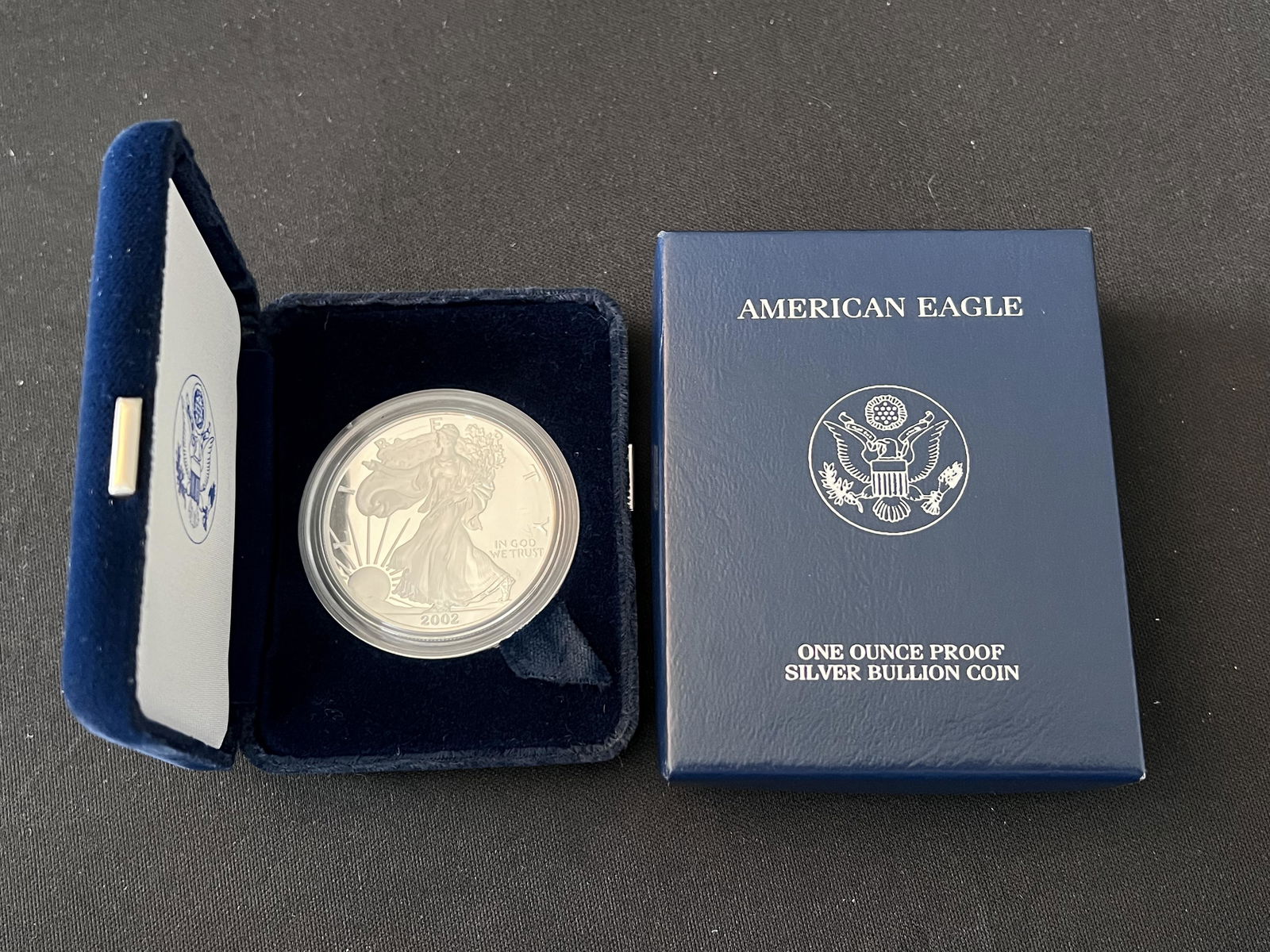 2002 American Eagle Silver Dollar Uncirculated Mint. In the original box and case. 1 ounce of: 2002 American Eagle Silver Dollar Uncirculated Mint. In the original box and case. 1 ounce of pure silver.