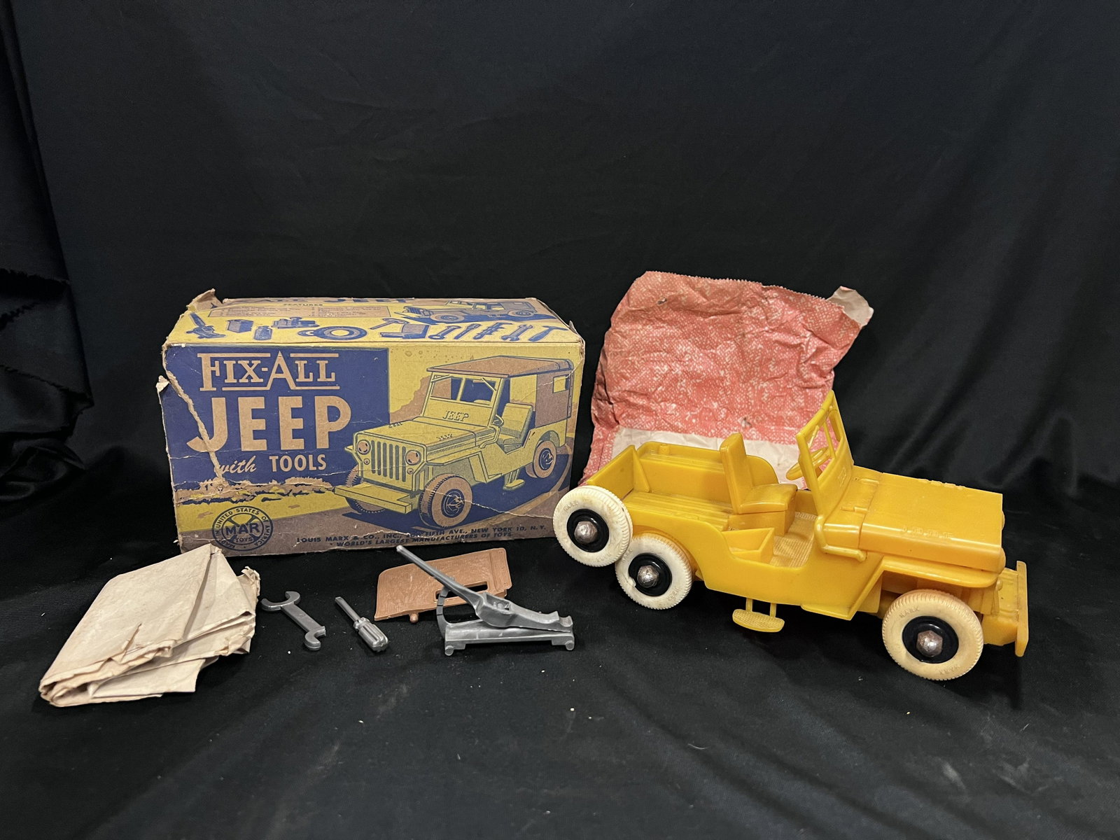 Fix-All Jeep with Tools Marx Toys: Comes with the original box that is missing one flap and is very brittle. The jeep is in good shape but has some parts missing and the windshield has a piece broke on it.