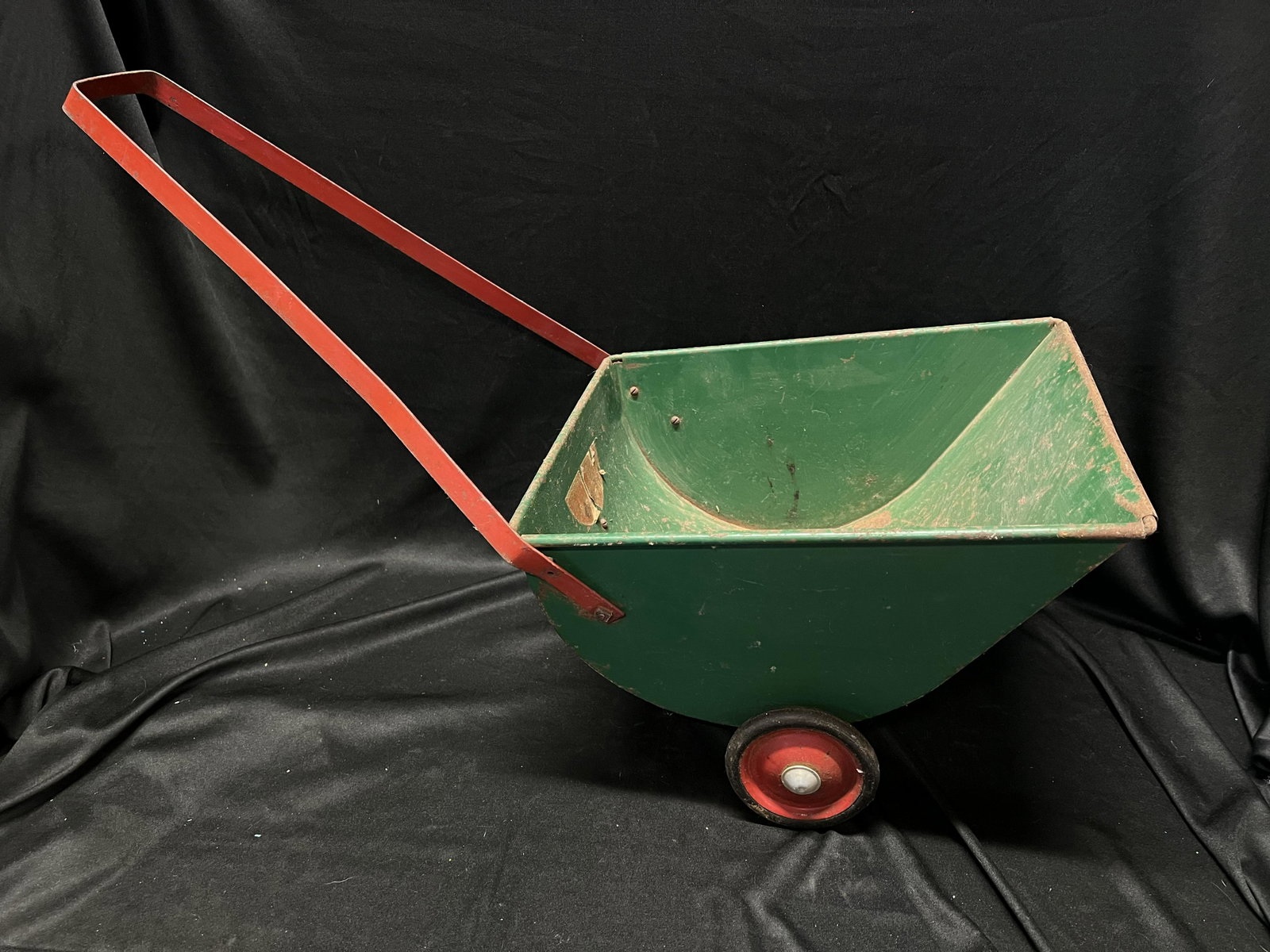Metal Toy Cart Large and in good condition with some rust and paint chips. Measures 9 inches tall: Metal Toy Cart Large and in good condition with some rust and paint chips. Measures 9 inches tall and 13 inches long not including the handle.
