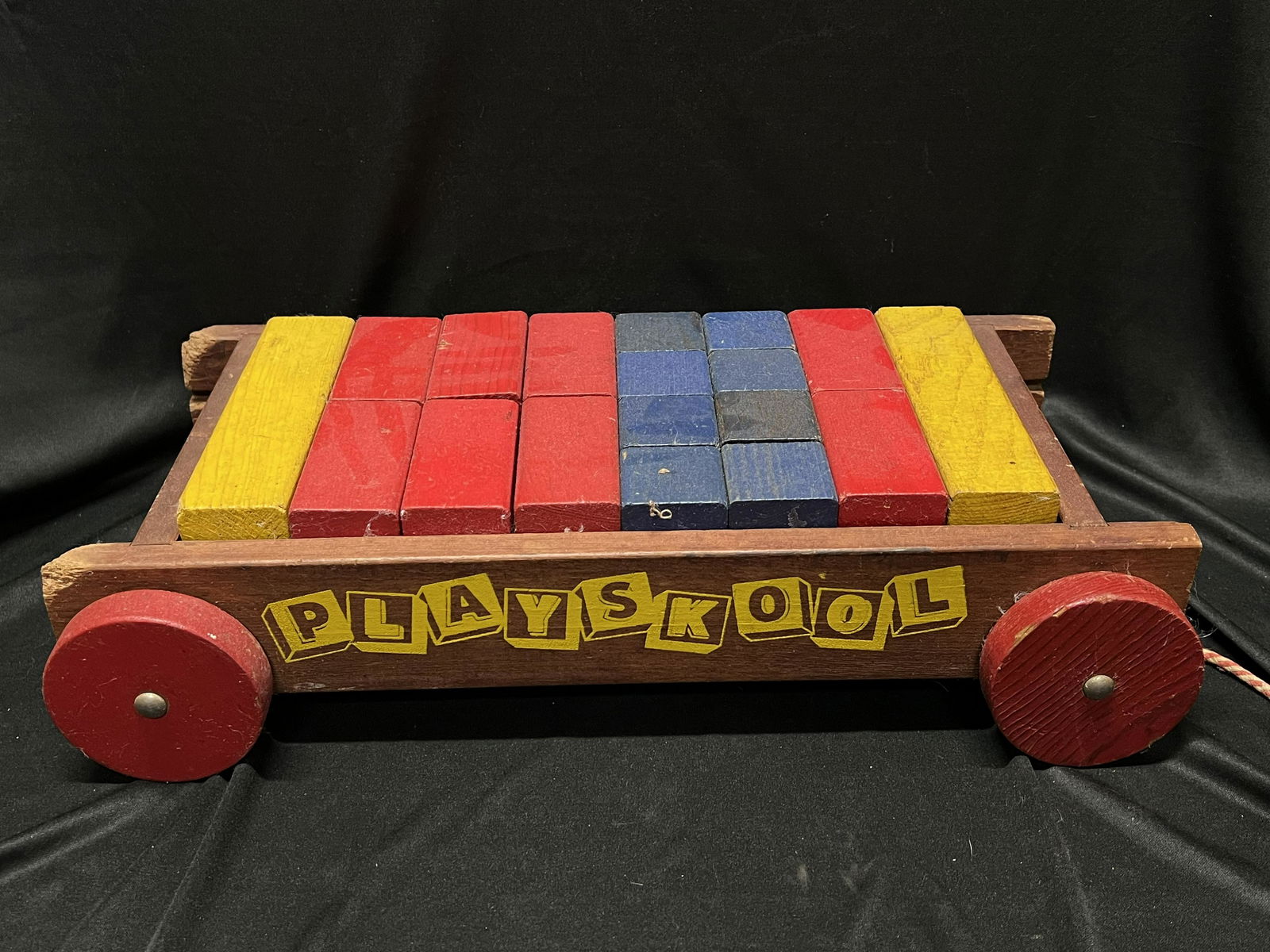 Playskool Vintage Wood Wagon with Shape Blocks: Playskool Vintage Wood Wagon with Blocks. The ends of the wagon were probably chewed on by a dog. All of the blocks are present which is probably very rare.