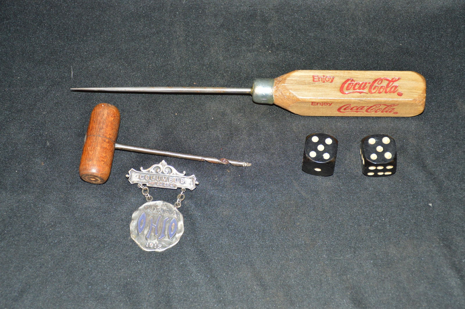 Coca Cola Ice Pick, Wood Wine Bottle Opener, Black Dice and a Columbus Pin.: Coca Cola Ice Pick, Wood Wine Bottle Opener, Black Dice and a Columbus Pin.