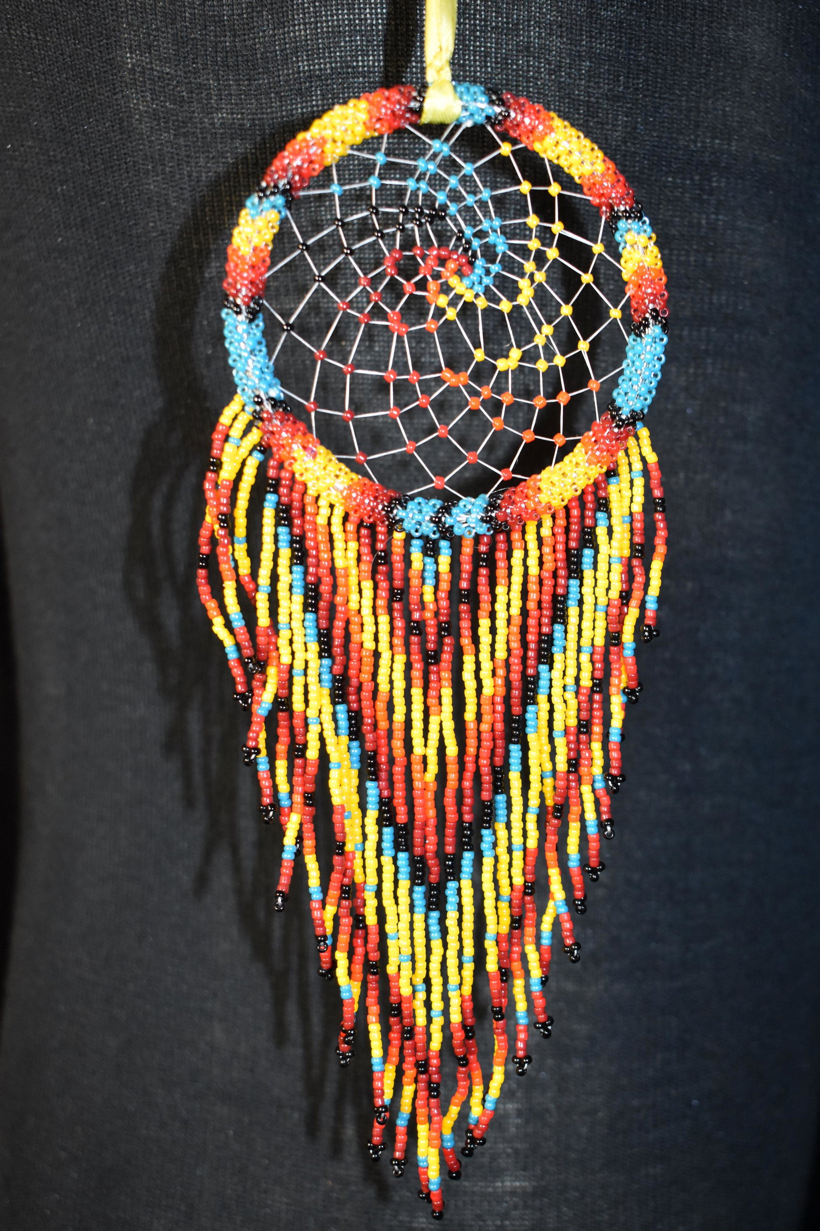 Elegant Hand Stitched Beadwork Dream Catcher by Carol Padilla of the San Juan Pueblo in New Mexico: Hand Stitched Beadwork Dream Catcher by Carol Padilla of the San Juan Pueblo in New Mexico. Measures over 8 inches not including the ribbon. Excellent/New Condition.