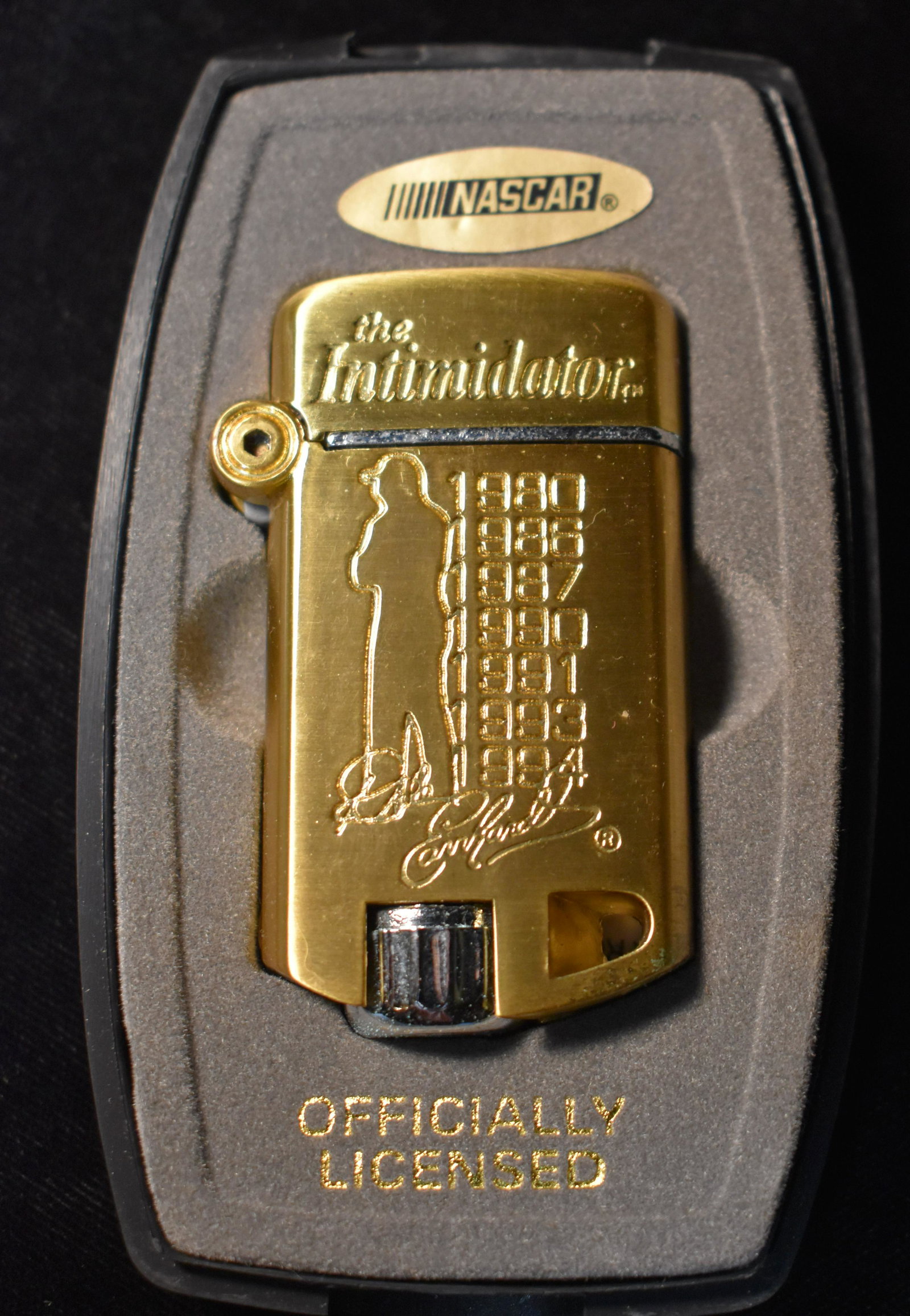 Dale Earnhardt Gold Lighter The Intimidator 2002 NEW: Dale Earnhardt Gold Lighter The Intimidator 2002 New in its original box.