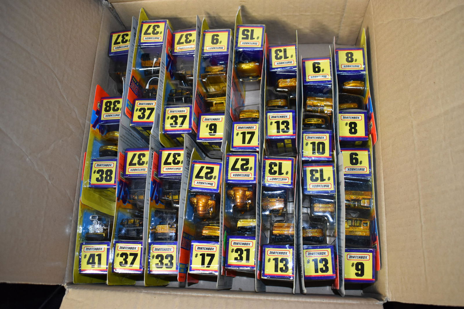 Box of 32 MATCHBOX GOLD 75 CHALLENGE One of 10,000 DIECAST CARS 1996: Box of 32 MATCHBOX 75 CHALLENGE One of 10,000 DIECAST CARS from 1996. They come in a hot wheels cardboard box which they fit nicely in. All are new in their original packages.