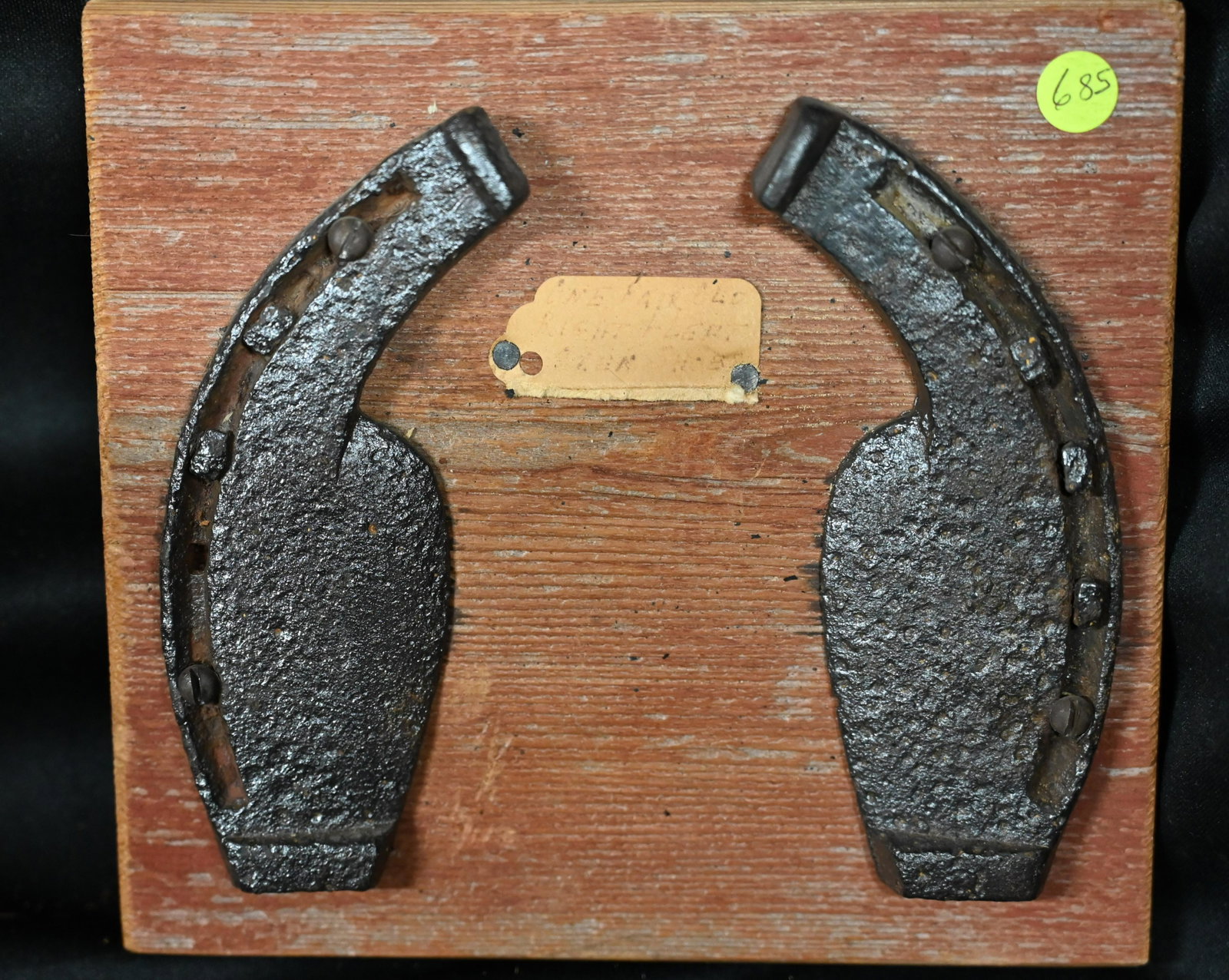 Pair of Ox Shoes nailed on a piece of barn wood with square nails. Dated back to the 1800's and: Pair of Ox Shoes nailed on a piece of barn wood with square nails. Dated back to the 1800's and very rare. Made to hang on the wall as a picture this would look great in any rustic dÃ©cor and are de