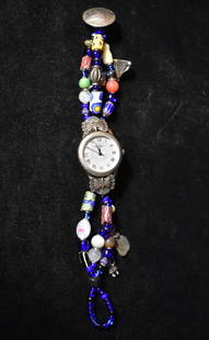 Fossil Beadwork Watch: Fossil Beadwork Watch. A bead worker decked this watch out with an elaborate beaded band. Will need a new battery. Measures 8"