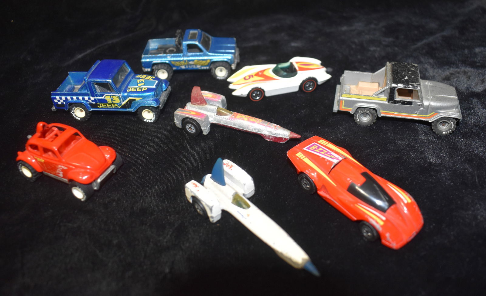 8 Vintage 1970's to 1984 Hotwheels Cars: Vintage Hot Wheels 1977 Trailbusters Bywayman w/ Eagle Chevy Pickup Truck. Some paint and decal chipping.; 1982 Hot Wheels REAL RIDERS JEEP SCRAMBLER SILVER. Fair amount of wear to paint.; 1982 Hot Wh