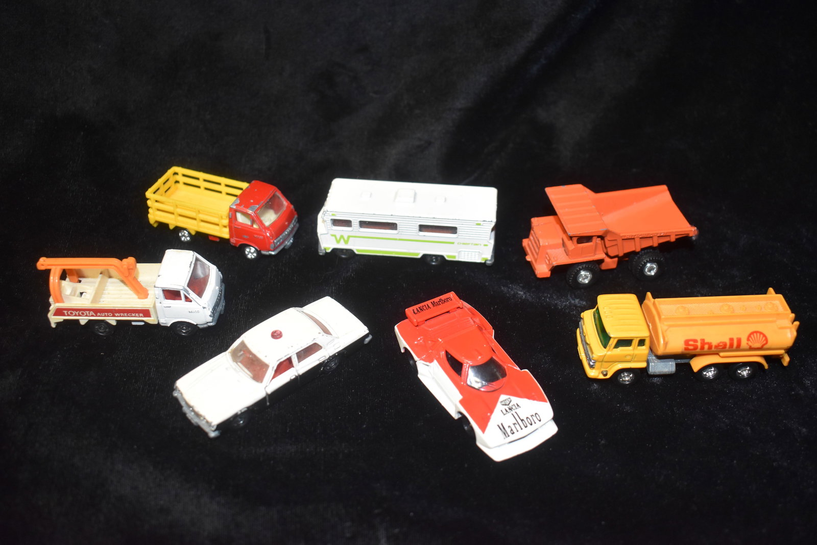 7 Vintage Tomica Diecast Cars going back to the 1970's: 1978 Tomica Winnebago Motor Home. Has a little wear to the paint.; RARE TOMICA Pocket Cars NO. F66 LANCIA STRATOS TURBO 1978 MARLBORO Size 1/62. Excellent condition for its age with minor paint chippi