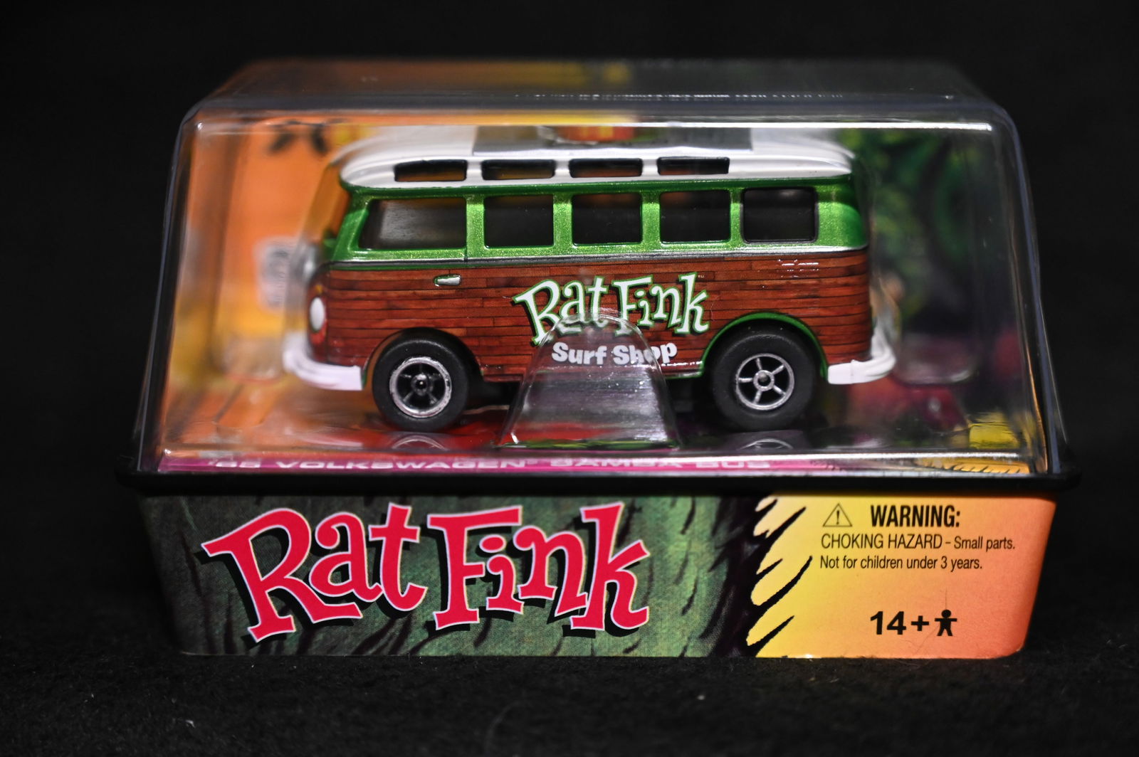 Auto World Rat Fink XTraction Ultra-G 65 Volkswagen Samba Bus Green. No.60. Brand new unopened slot: Auto World Rat Fink XTraction Ultra-G 65 Volkswagen Samba Bus Green. No.60. Brand new unopened slot racing diecast car in mint condition produced in 2011. Character created by Ed "Big Daddy" Roth.