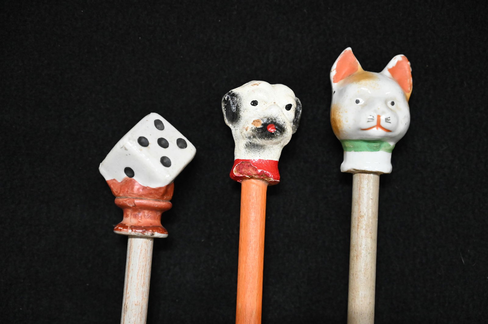 3 Carnival Canes with a Ceramic/Porcelain Top of Dice, Cat & Dog figures on top and a wood rod.  The (1 of 5)