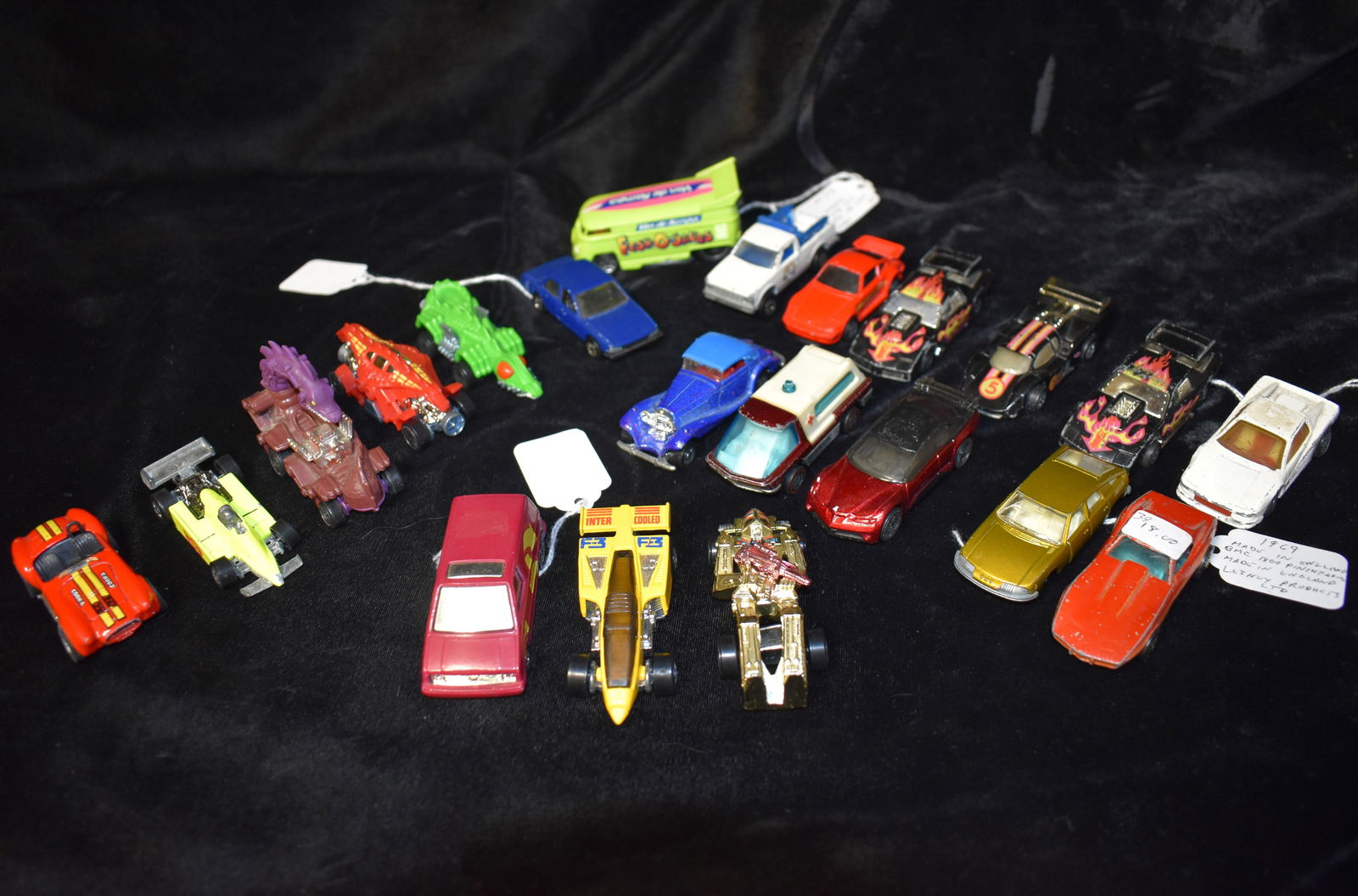 20 1980's Hotwheels and a 1969 Lesney Car: 20 1980's Hotwheels and a 1969 Lesney Car. All cars in this lot were someones toy they played with at some point long ago. Conditions vary. See photos. They measure 2 1/8" to 4 1/2"