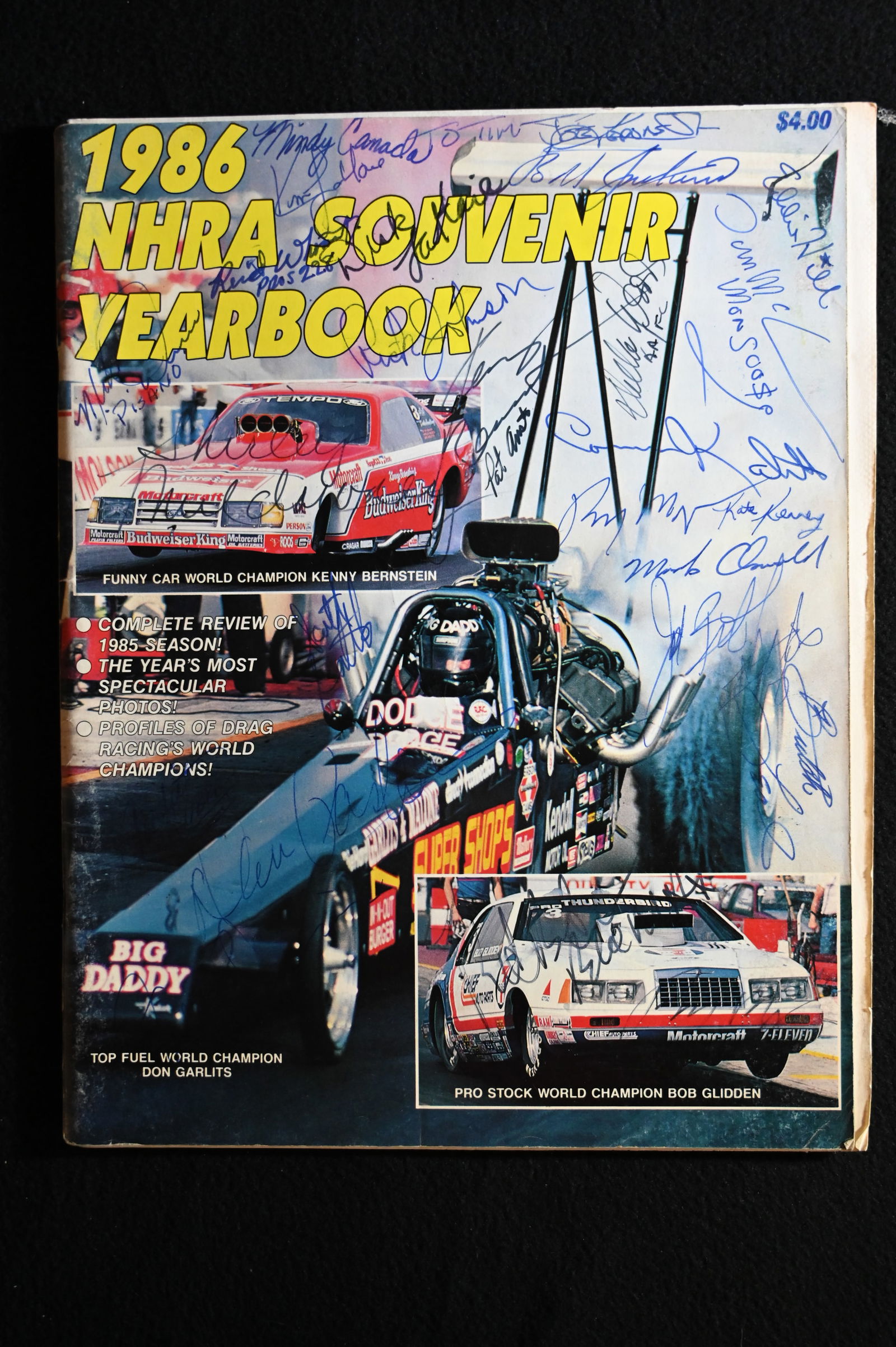 1986 NHRA Souvenir Yearbook with over 30 Autographs.  Includes Eddie Hill, Tom Mcewen "Mongoose", (1 of 6)