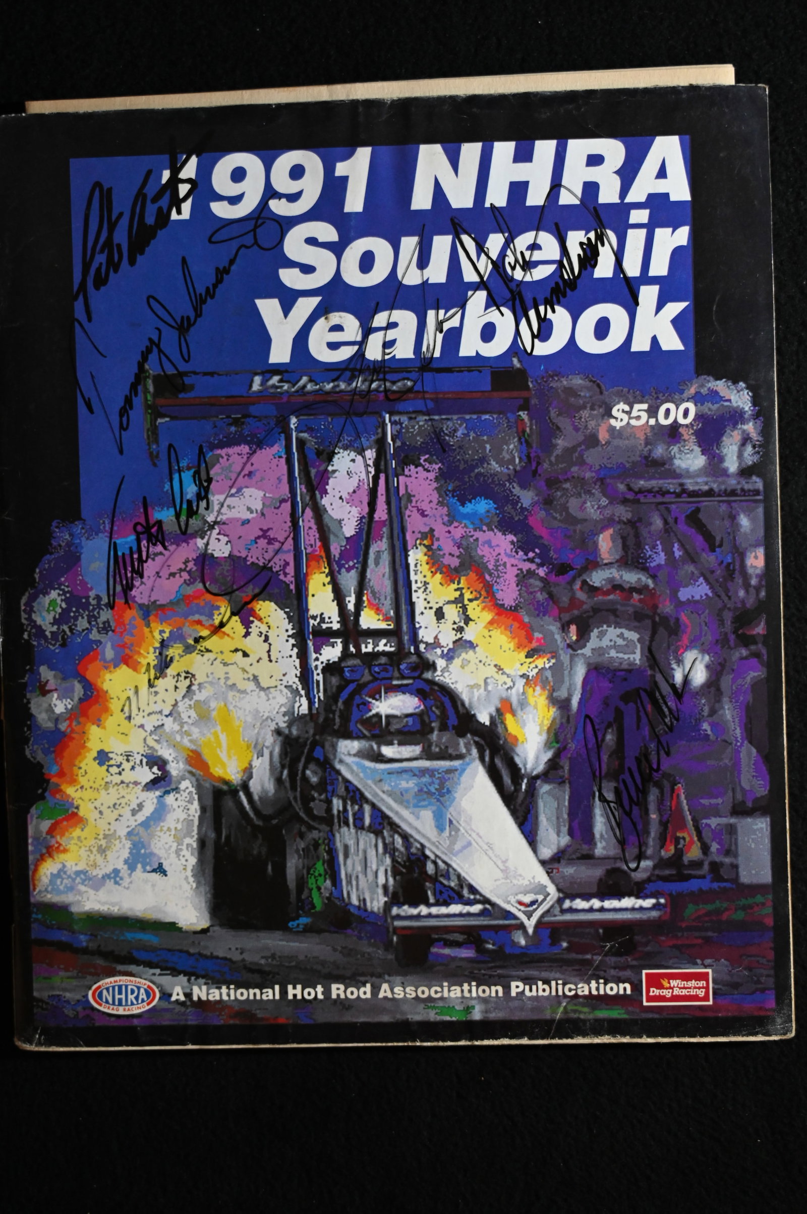 1991 U.S. Nationals Souvenir Program NHRA with over 30 Autographs. Includes Tommy Johnson, Eddie: 1991 U.S. Nationals Souvenir Program NHRA with over 30 Autographs. Includes Tommy Johnson, Eddie Hill, Don Garlits, Joe Amato, & many more.
